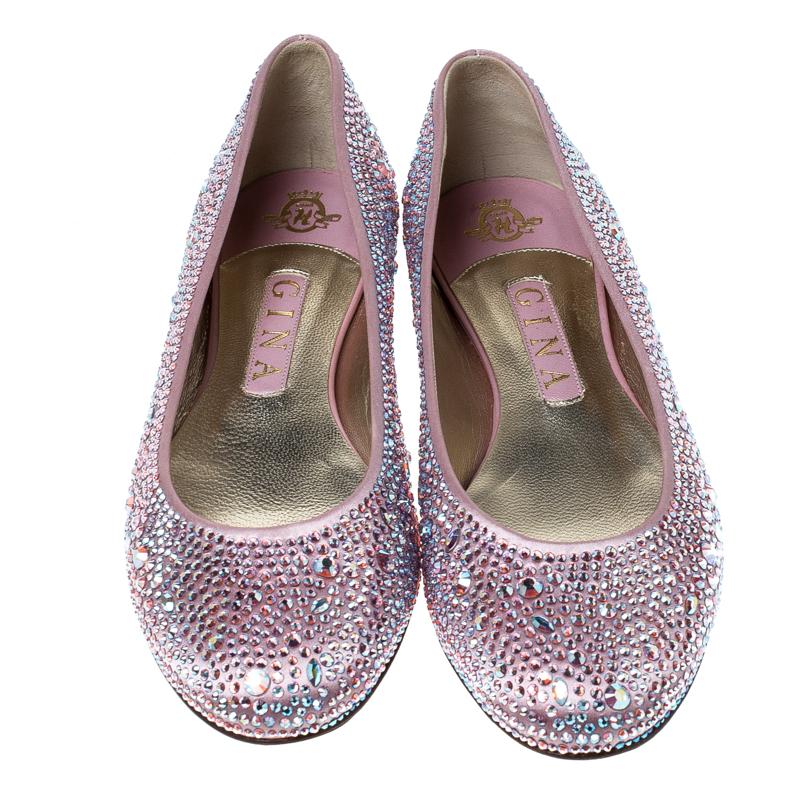 A glittering creation from Gina, these ballet flats can truly transform an outfit. They have been crafted from luxurious satin and completely embellished with crystals. They are lined with leather and have comfortable leather-rubber soles. A