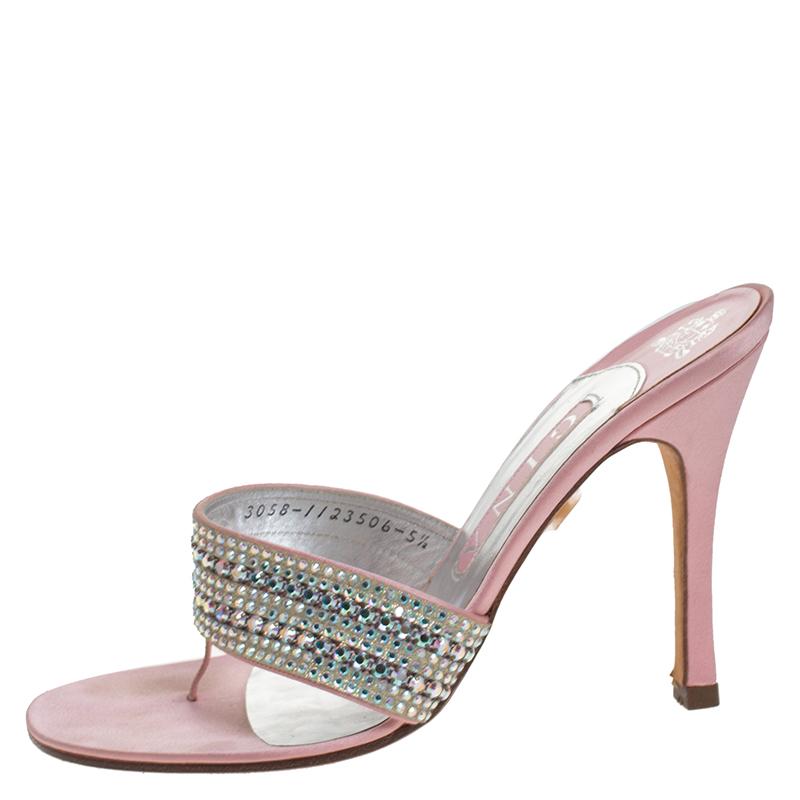 Keep it simple yet gorgeous in these sandals from the house of Gina. Crafted in England, they are made of luxurious satin and come in a lovely shade of pink. These feminine sandals are further beautified with crystal embellishments on the uppers.