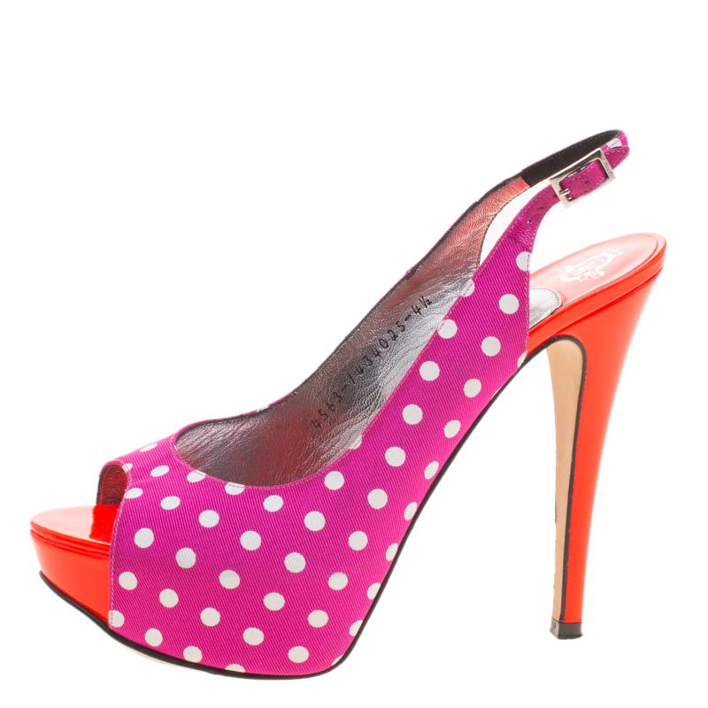 Designed for the summer day time parties and events, these Gina slingback sandals are one for the fun and flirty fashion loving girl. Constructed in purple polka dot fabric, these peep toe sandals are accented with orange leather in sole for an