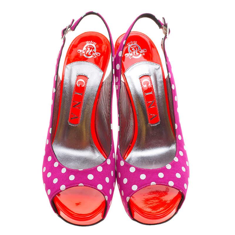 Designed for the summer day time parties and events, these Gina slingback sandals are one for the fun and flirty fashion loving girl. Constructed in purple polka dot fabric, these peep toe sandals are accented with orange leather in sole for an