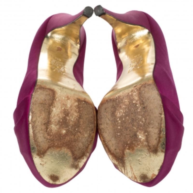 Elegance and grace all in one! These purple Gina pumps have been crafted from rich satin and styled with ruched detailing on the toes to make them resemble a hoodie. They are equipped with comfortable leather-lined insoles and elevated on concealed