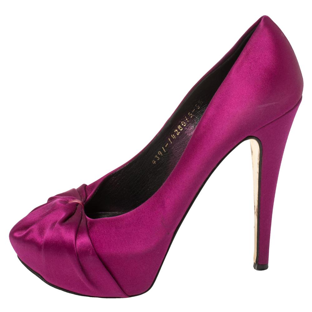 Elegance and grace all in one! These purple Gina pumps have been crafted from rich satin and styled with ruched detailing on the toes to make them resemble a hoodie. They are equipped with comfortable leather-lined insoles and elevated on concealed