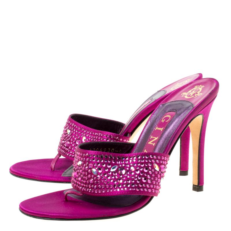 Bursting with shimmer, Gina designed these sandals to catch one's eye. They are constructed in a thong style and embellished with beautiful crystals. The purple sandals will give you glamour and lift you and your confidence.

