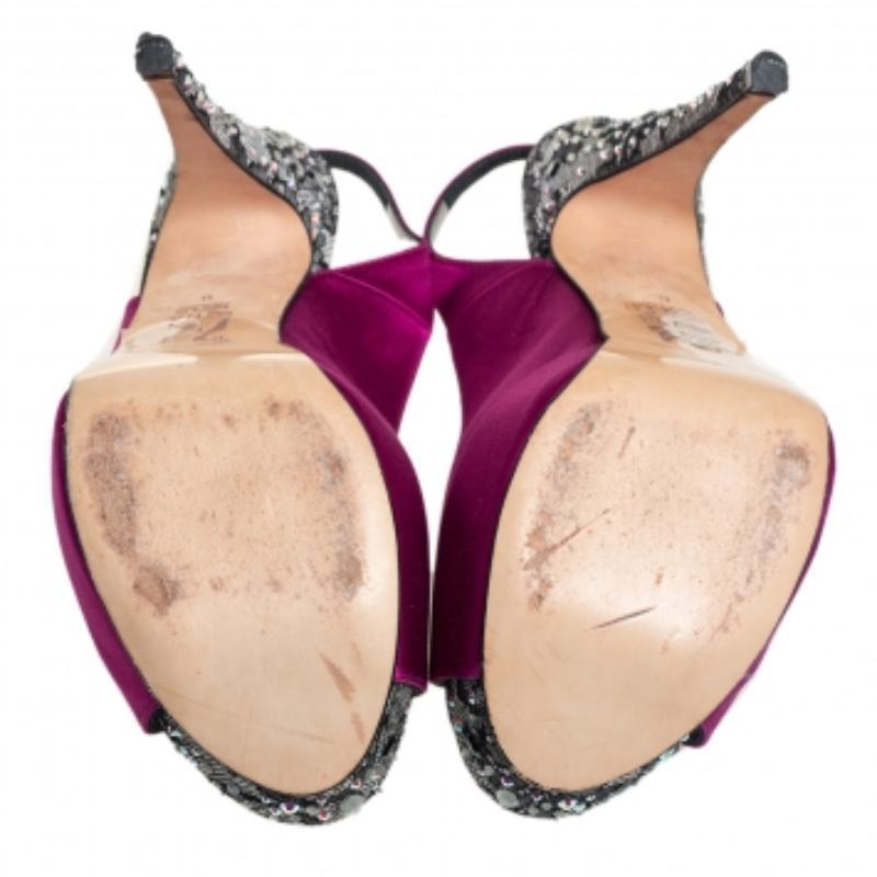 Gina knows how to make hearts skip a beat and these purple sandals do just that! They come crafted from satin in a peep-toe silhouette and feature crystal-embellished platforms and heels. They are equipped with comfortable leather-lined insoles and