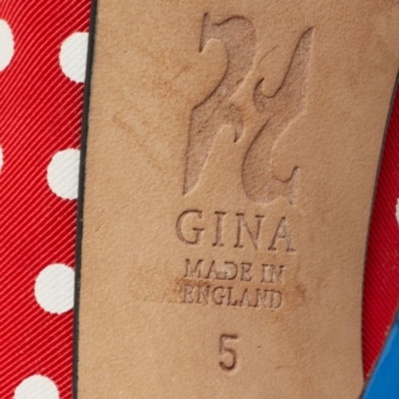 Gina's pumps are here to steal the limelight. Created using red-blue canvas, these stunning pumps feature cute polka-dotted prints throughout. They have peep-toes, platforms, and 13 cm heels. Style these Gina pumps with your party outfits, and look
