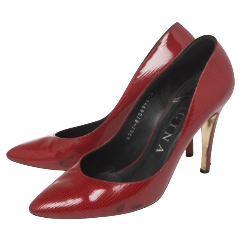 These Gina pumps are a reflection of the label's immaculate artistry in shoemaking. Crafted from lizard-embossed leather in a red shade and glossy finish, these beauties have a timeless appeal and can add oodles of sophistication to your ensemble.