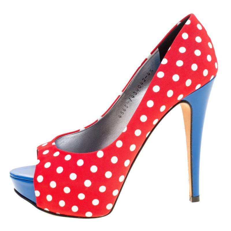 Designed for day time parties and events, these Gina pumps are one for the fun and flirty woman who is not afraid to experiment! Constructed in polka dot printed canvas, these peep-toe pumps are accented with blue leather insoles for an added pop of