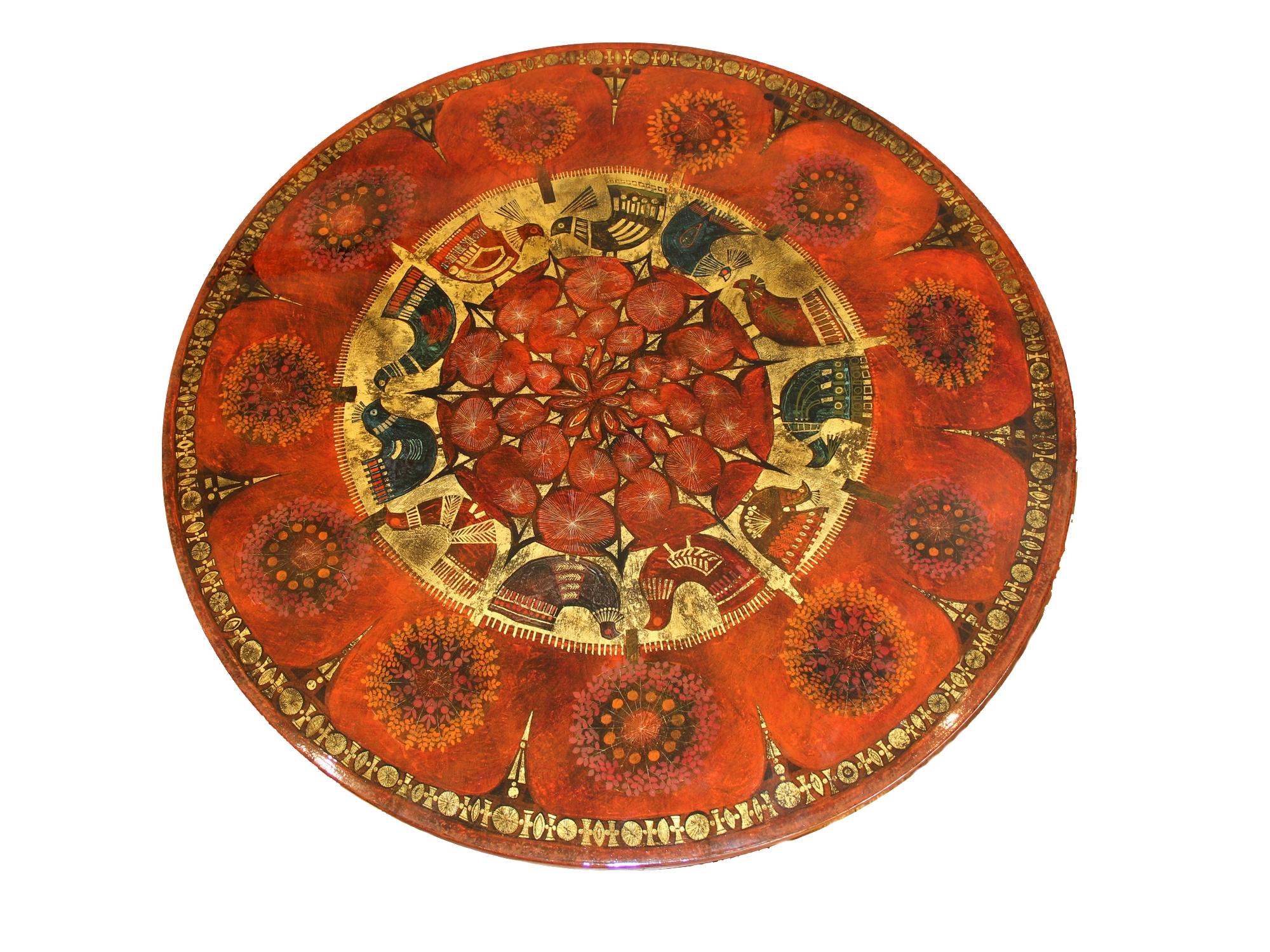 Tripod pedestal table in red lacquer, decorated with ink and gold leaf of birds, trees and stylized geometrical patterns. Signed Ginette Raoult in the décor, France, circa 1960.