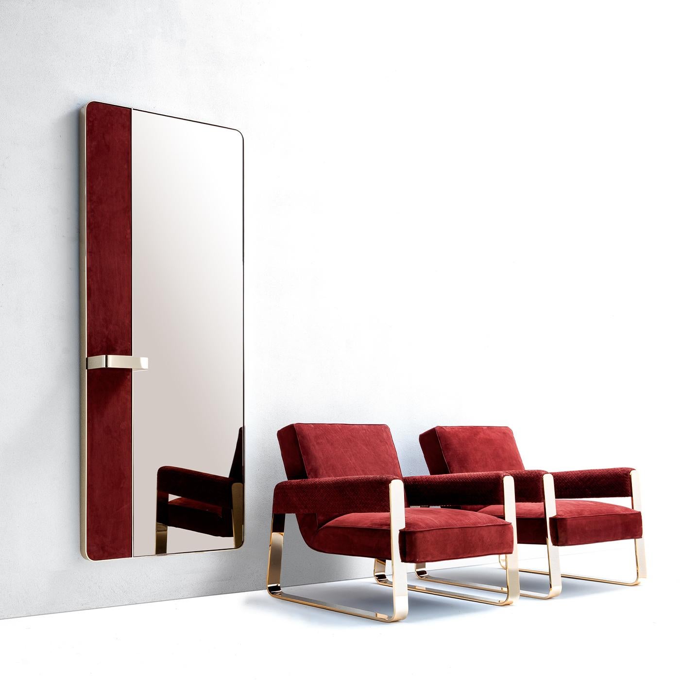 An elegant and refined piece of functional decor, this wall mirror by Andrea Pinori and Giorgio Balestri is distinguished for its delicate and sophisticated color palette. Showcasing a metal finish which recalls the gold-colored metal frame, it is