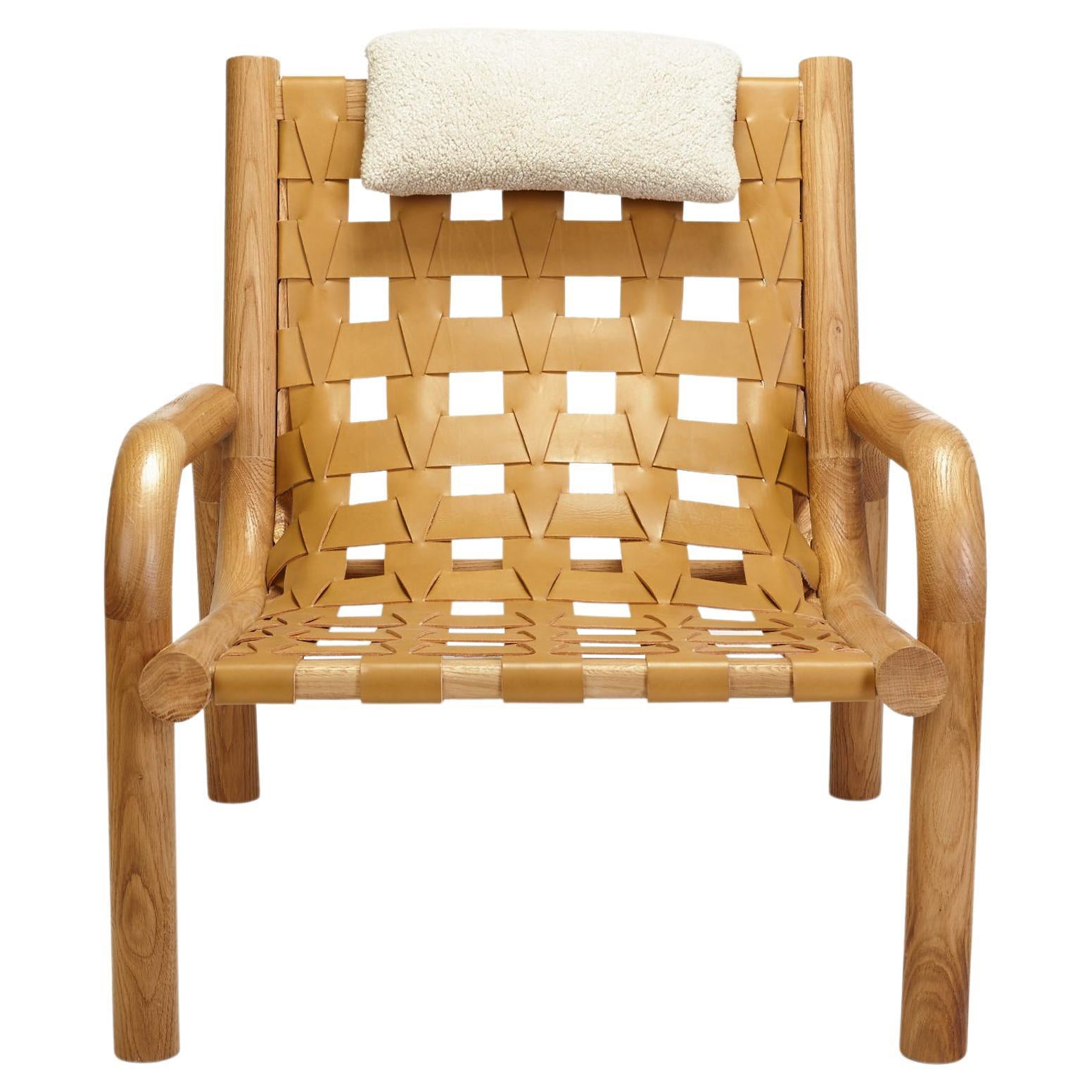 Poltrona Ginga in pelle, in legno massello di Oak Oak, realizzata a mano in Portogallo da Duistt