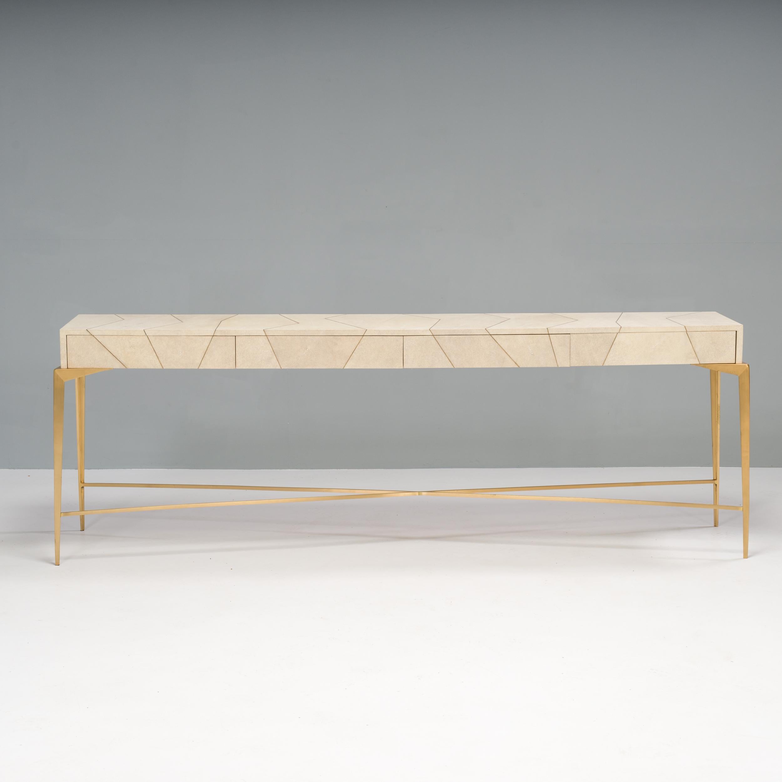 Handmade in France, Ginger Brown furniture is crafted from rare materials to create unique and luxurious designs.

The Hydra console table is covered in natural shagreen with a linear brass patchwork pattern to create a geometric effect. 

The table