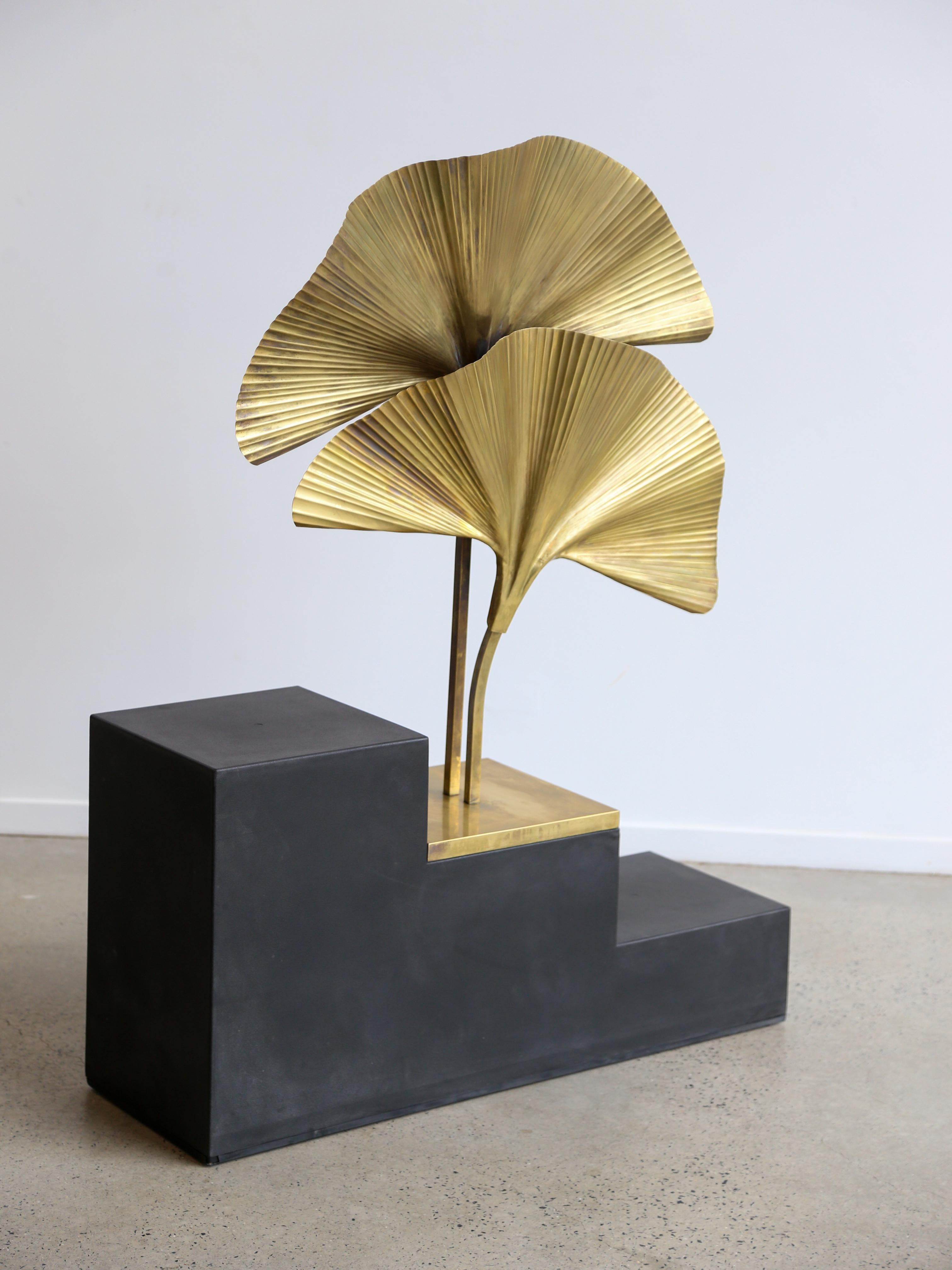 Contemporary design table lamp entirely made of brass with two Ginko leaves and square base.

This combination of brass and botanical elements creates a stylish design and nature-inspired lighting fixture. The Ginkgo Biloba is a tree known for its