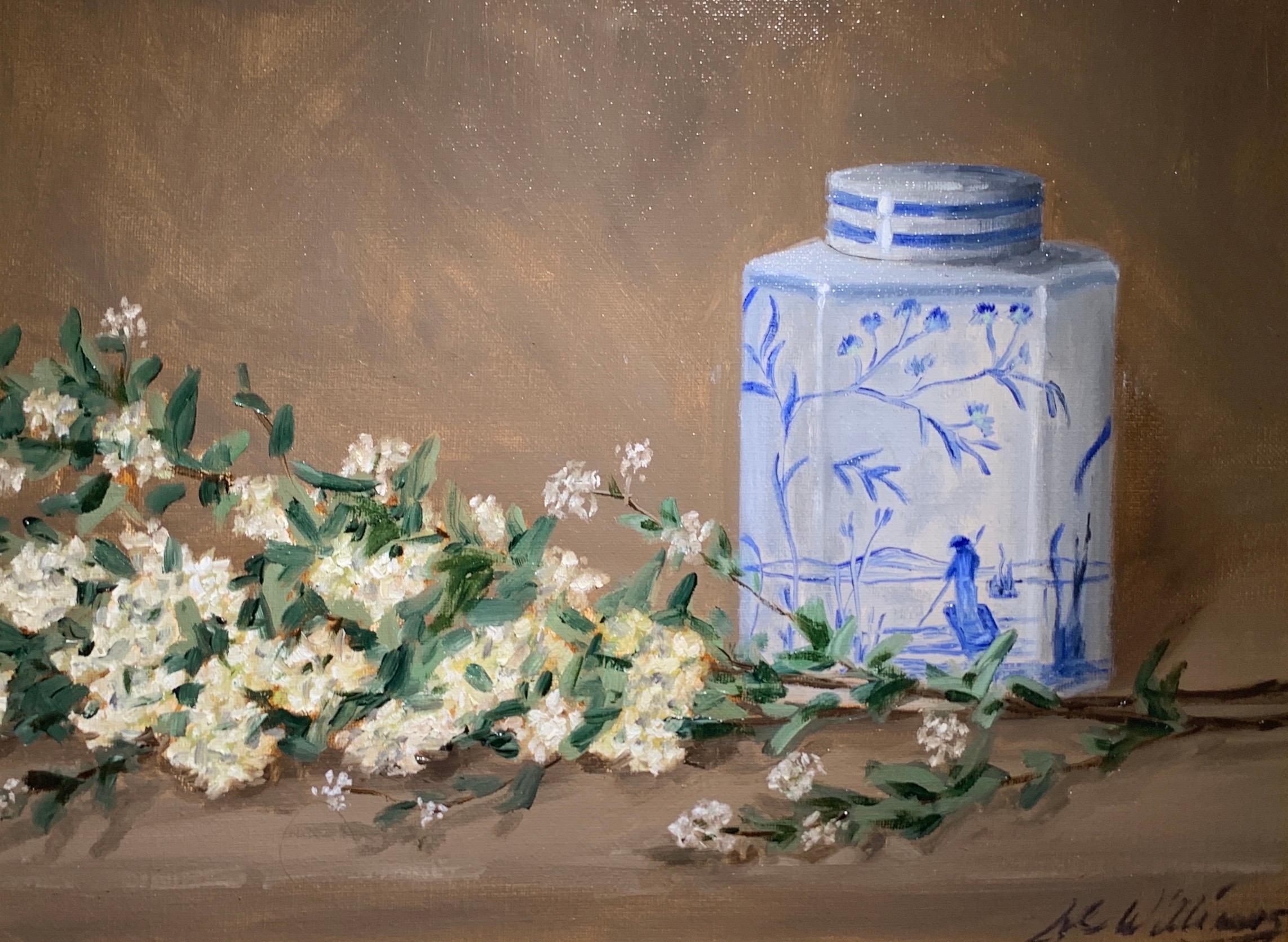 'Still Life With Blue and White' is a small framed representational oil on canvas still life painting created by American artist Ginny Williams in 2020. Featuring a palette made of blue, neutrals and white, accented by black and brown colors, the
