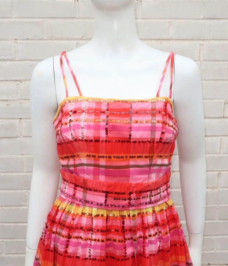 1960's sundress in a brightly colored seersucker madras plaid fabric by Gino Charles, a division of Malcolm Starr.  Gino Charles was actually a label created by Teal Traina and Malcolm Starr in the mid 1960's.  This adorable dress combines a casual