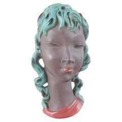 Gino Manca. Stylized female head with turquoise hair. Mid-20th Century