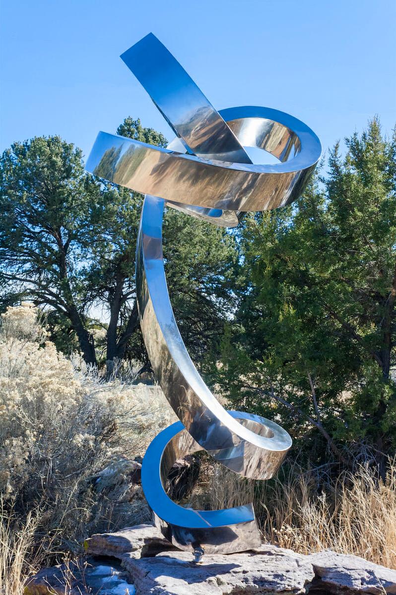 "Moonlight" by Gino Miles
Abstract sculpture in stainless steel

Working primarily in fabricated stainless steel and bronze, Gino Miles creates pieces focussed on elegant minimalism and cleanliness of line and shape — the curvilinear, often