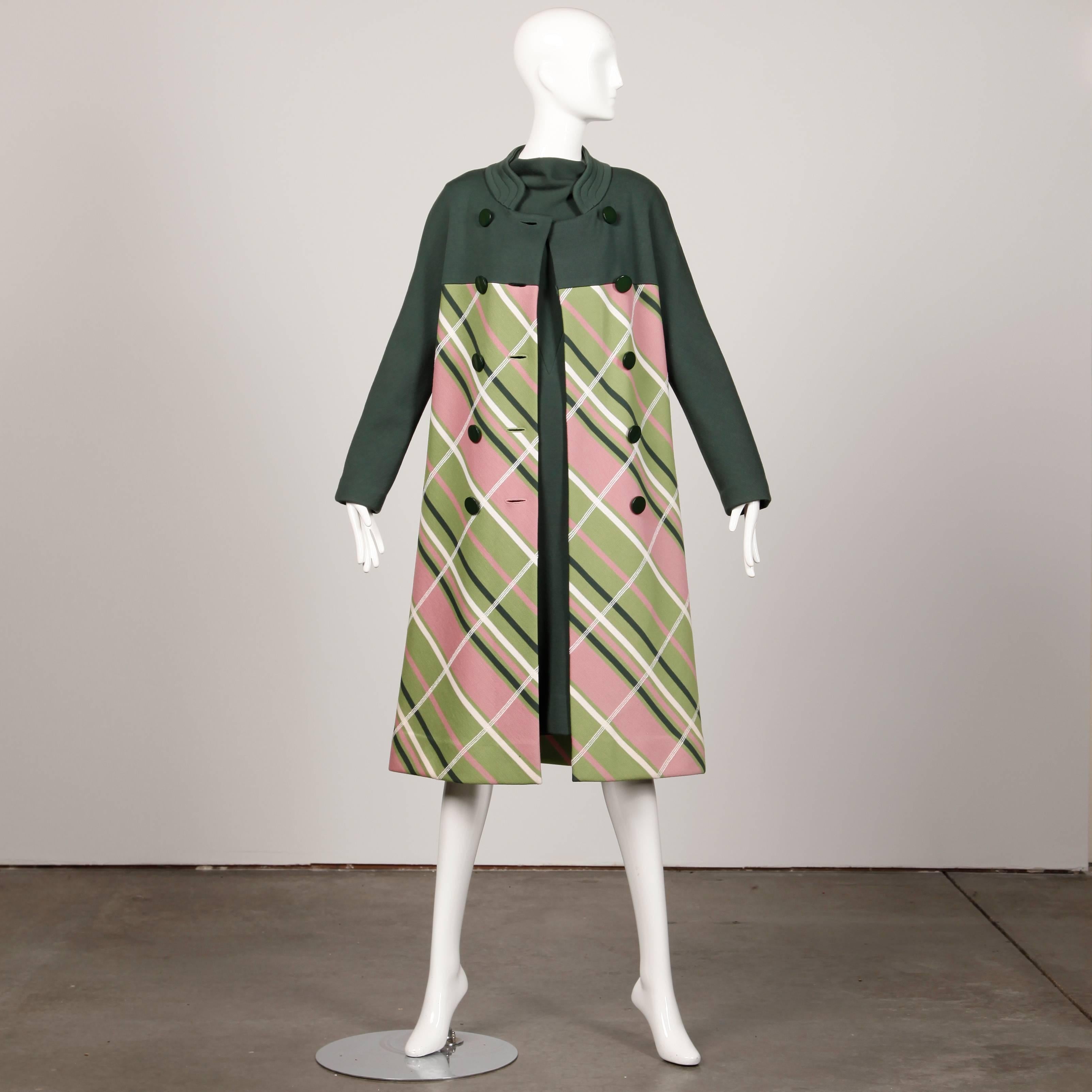 Chic 1960s wool knit coat and dress set in shades of avocado green and pink plaid by Gino Paoli. Both pieces are unlined and made of fine quality 100% wool knit. The dress zips up the back and the coat features double breasted buttons. The marked