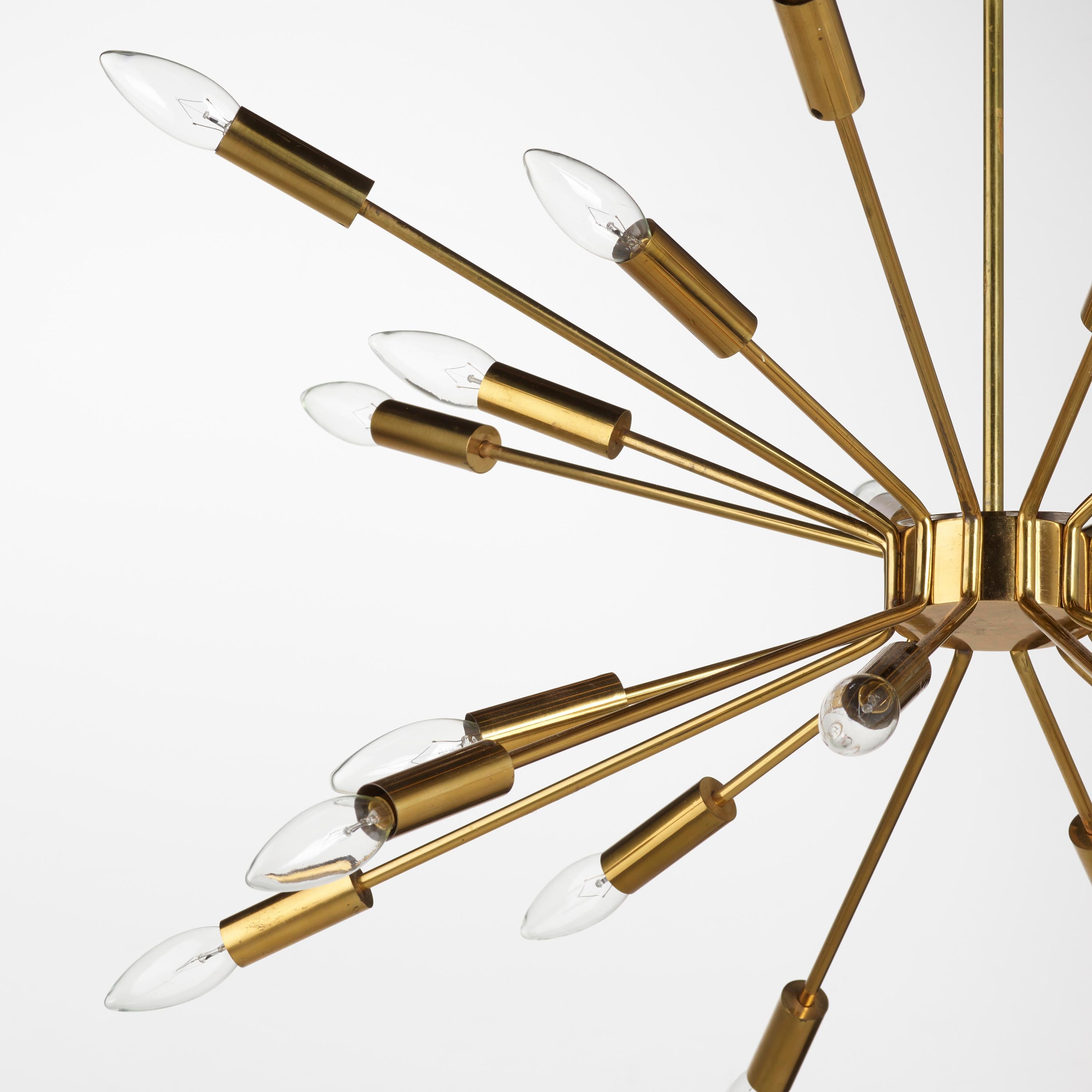 Very rare and iconic Gino Sarfatti for Arteluce brass chandelier. Originally designed circa 1939, its manufacturing execution occurred in 1953 after Sarfatti opened his own company, Arteluce. 

Known as 'Fuoco d'artificio,' or 