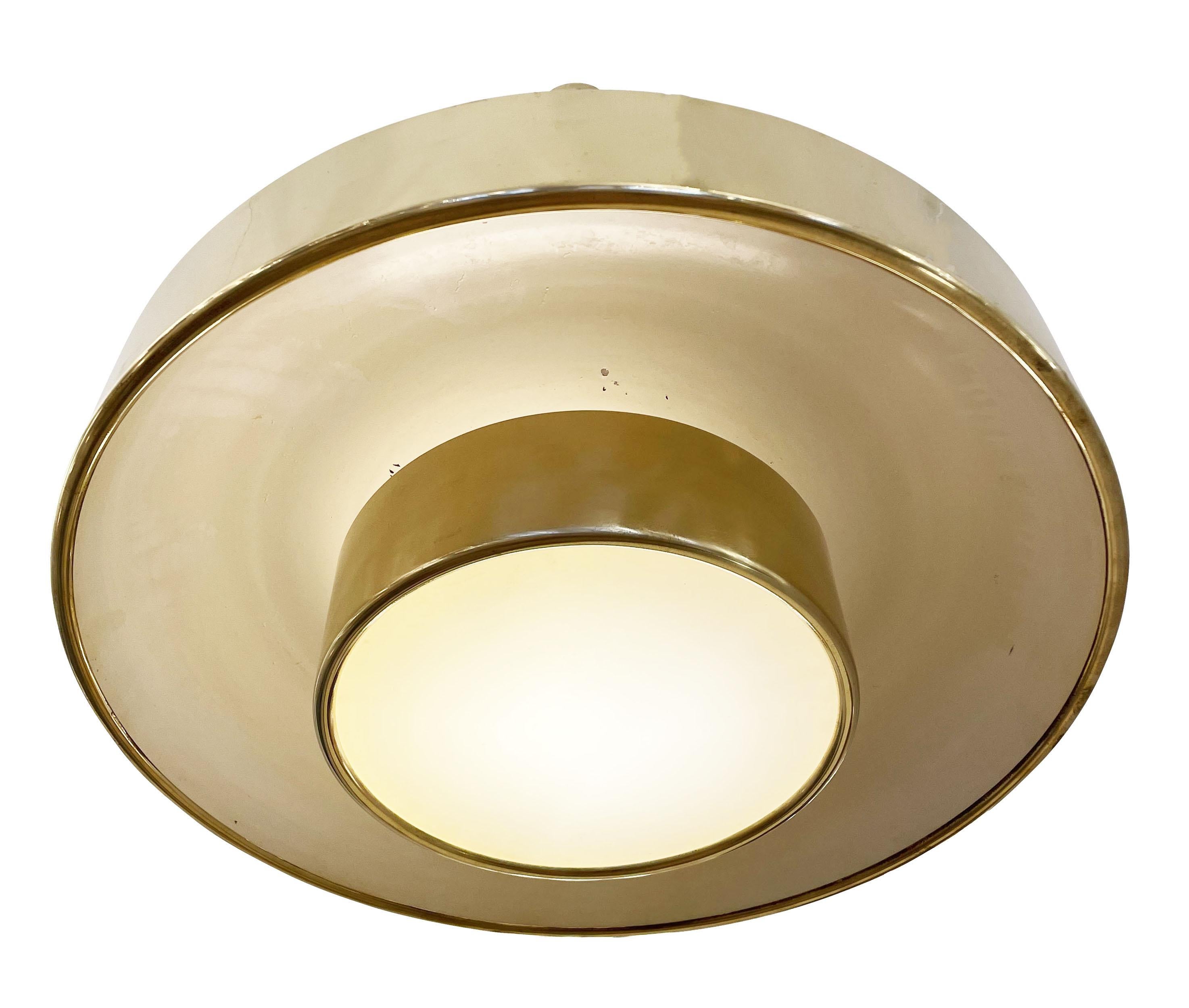 Italian Mid-Century pendant attributed to Gino Sarfatti. The entire piece is made of brass with the central diffuser being partially lacquered off-white to help diffuse the light. It has two glasses; one at the bottom and one above the central