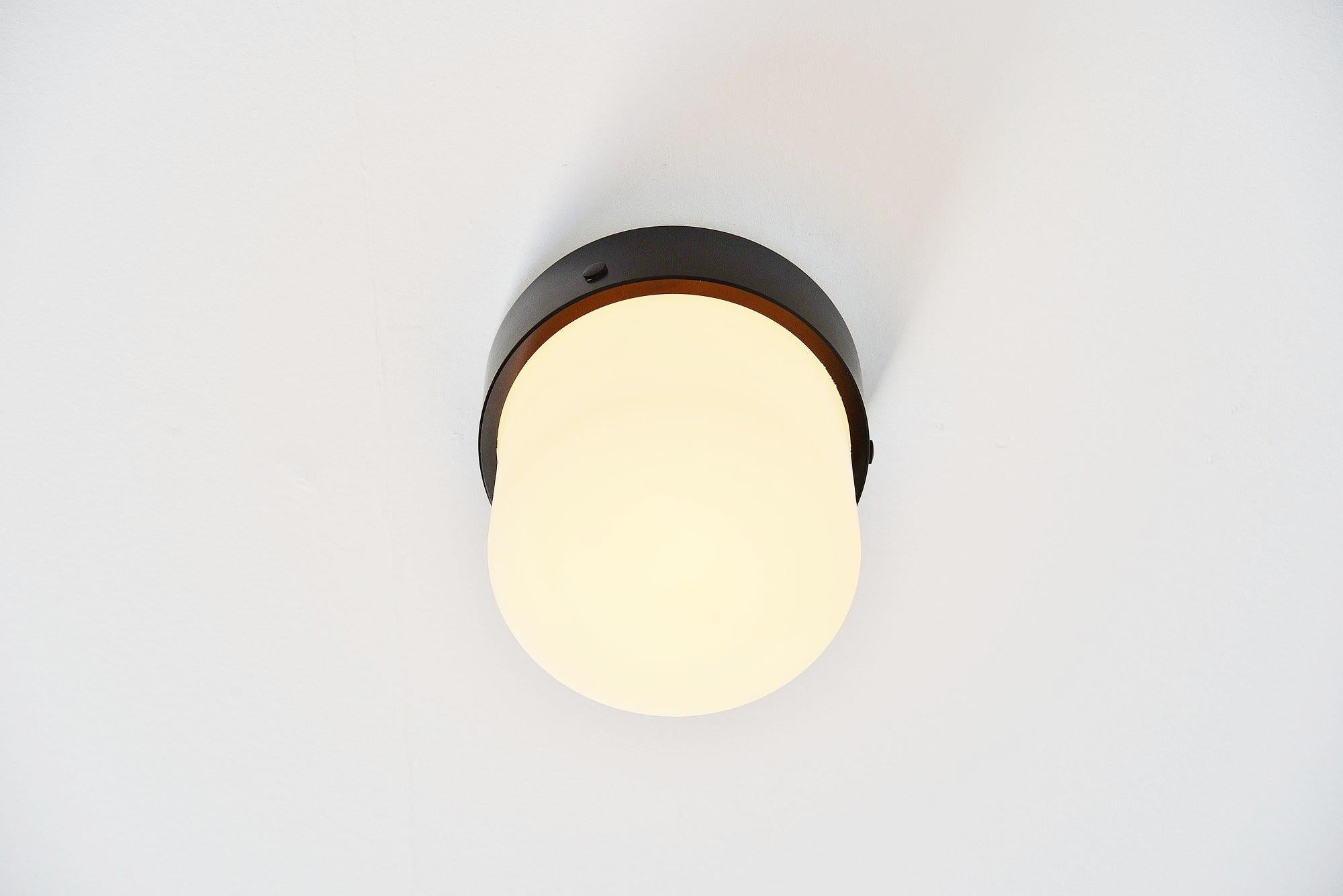 Pair of minimalist ceiling lamps model 3030 designed by Gino Sarfatti, manufactured by Arteluce, Italy, 1950. This light exists in 3 parts, a white painted base, with a black painted aluminium diffuser ring and a white milk glass shade. This lamp is