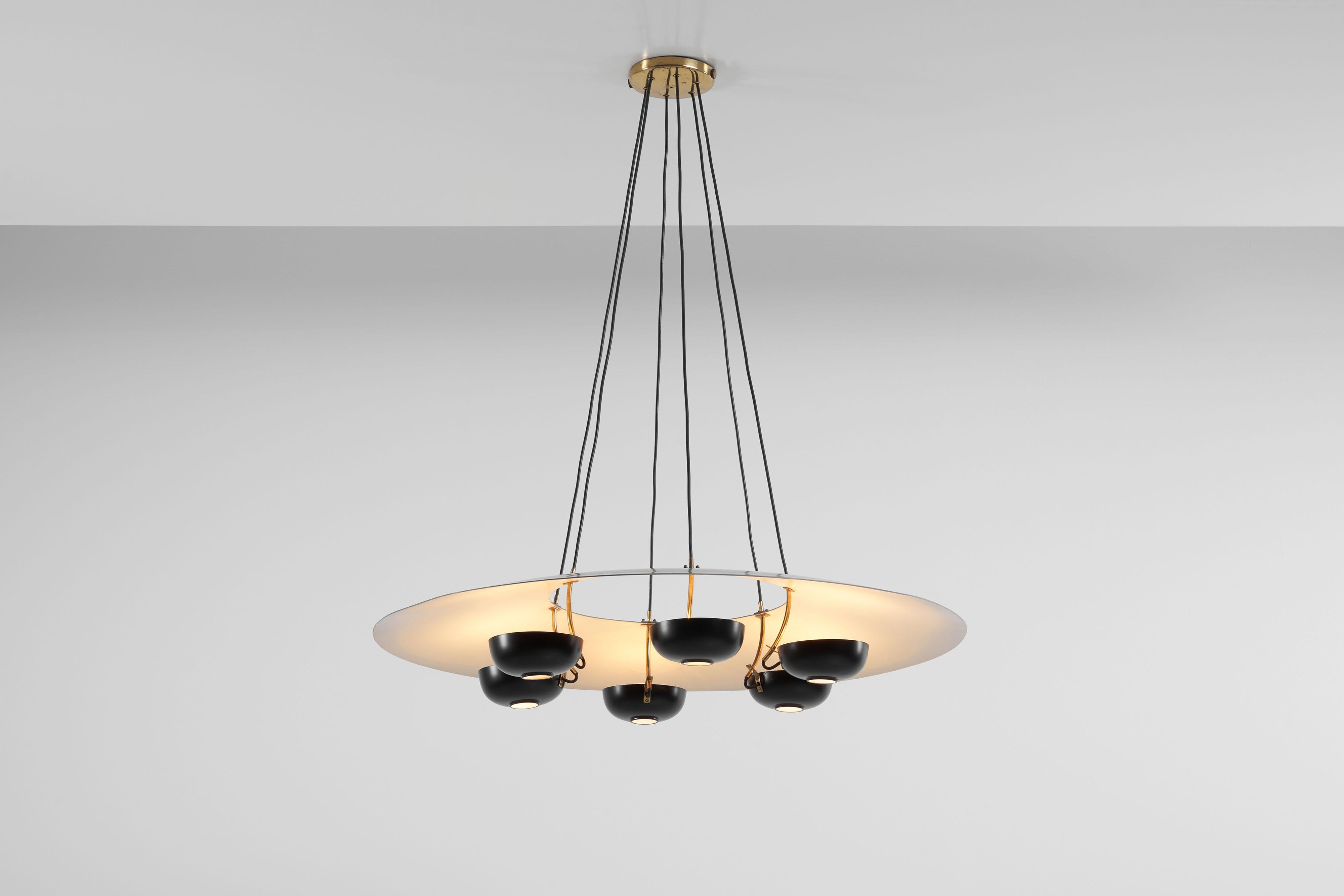 A monumental model 2058 chandelier designed by Gino Sarfatti and manufactured by Arteluce, Italy 1954. This large sized chandelier has a disk-shaped reflector with a hole in the middle which was painted white on the inside and grey on the outside.