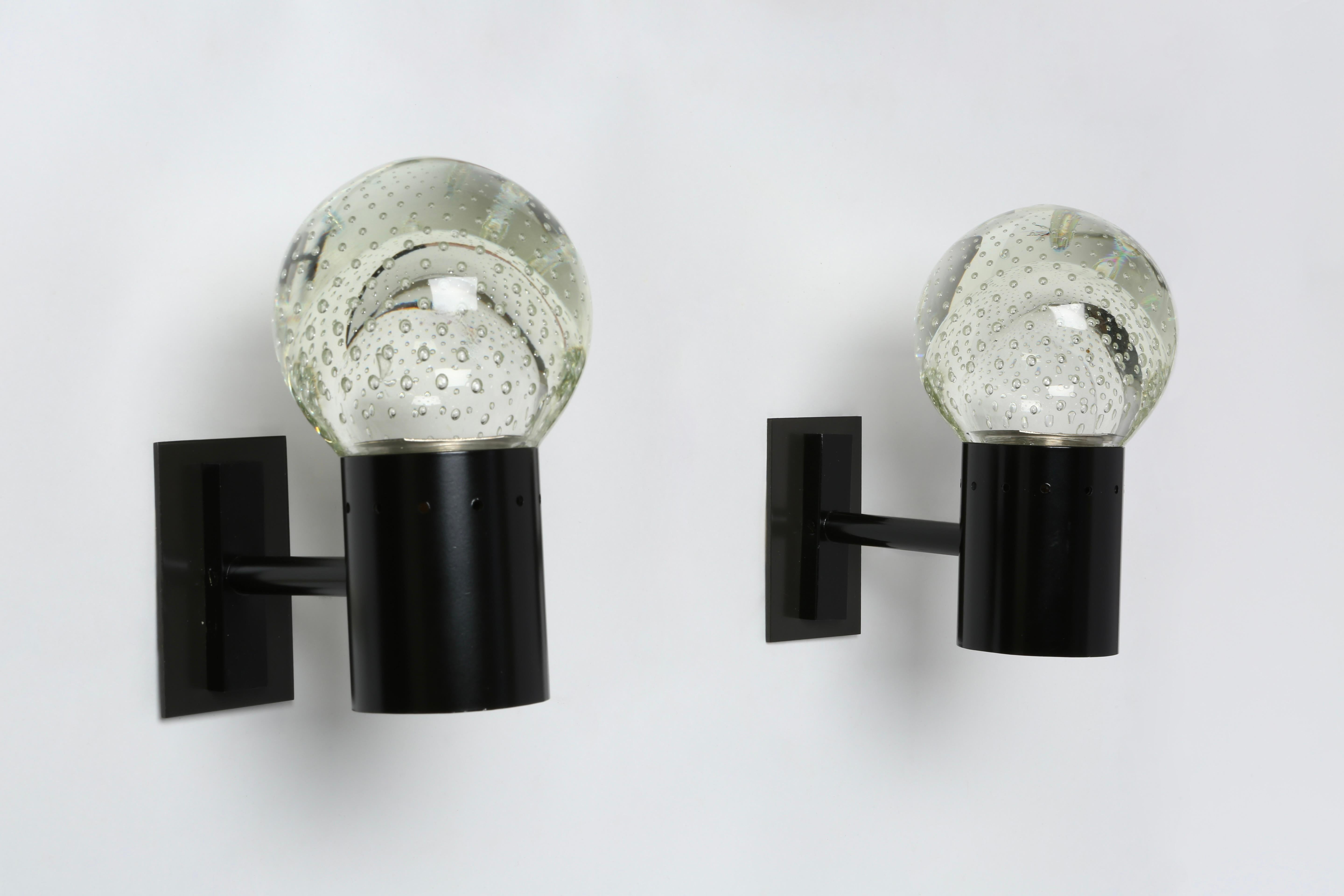 Gino Sarfatti for Archimede Seguso sconce.
Designed and manufactured in Italy in 1950s.
Seguso bullicante glass and enameled metal frames.
Rewired for US with custom made brass back plates.
Takes 1 candelabra bulb.
Restored. Metal re-enameled.
Price