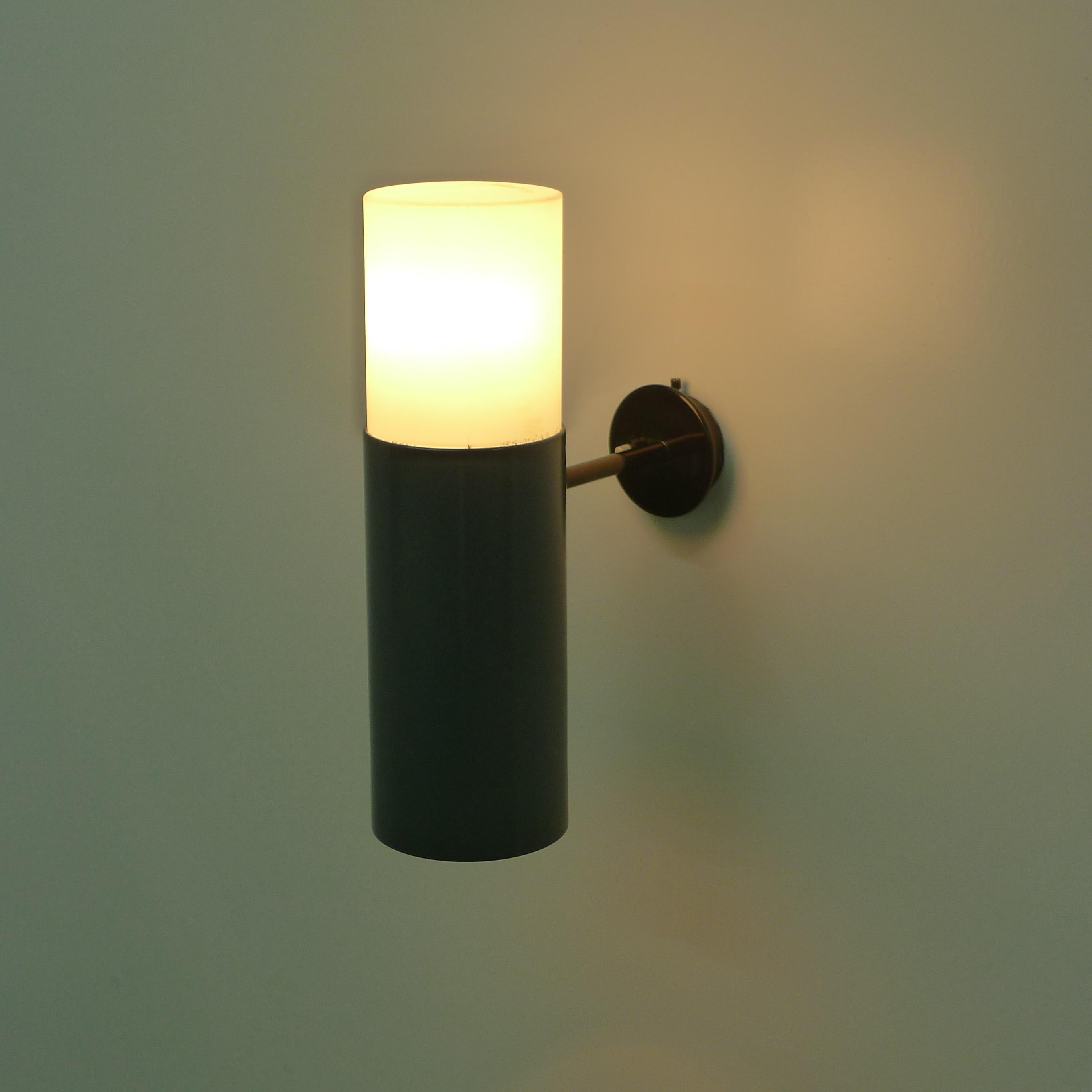 Gino Sarfatti, Model 205 Wall Light, designed 1955 and manufactured by Arteluce, Italy.

This rare model is illustrated in the Sarfatti catalogue raisonée.

Constructed from an opaline glass diffuser which slots into a black lacquered metal shade,