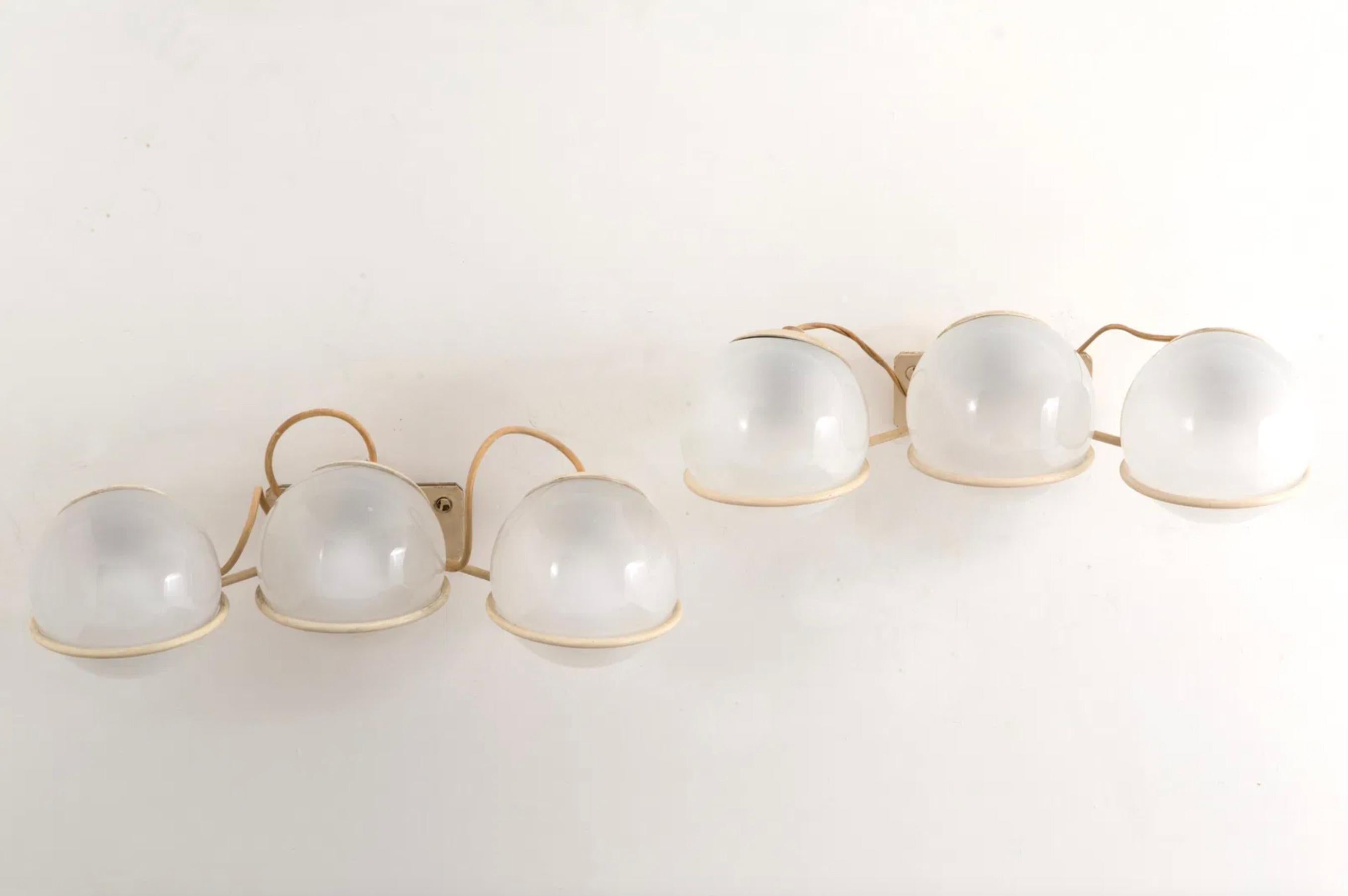 A rare and sophisticated pair of three-light wall lamps, Model 238/3, designed by the renowned Gino Sarfatti for Arteluce in the 1950s-60s. These exceptional pieces perfectly embody the elegance and innovation of mid-century Italian design,