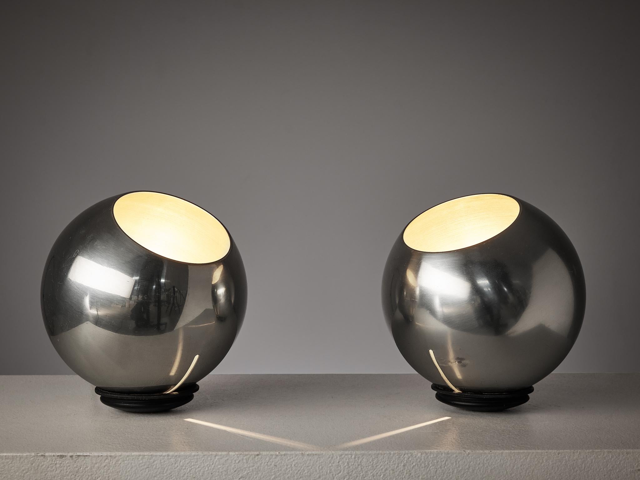 Gino Sarfatti for Arteluce, pair of table or floor lamps, model '586', aluminum, wire, Italy, 1962.

Pair of stunning aluminum lamps designed by Italian designer Gino Sarfatti for Arteluce. The round spheres are placed on a flat aluminum base and