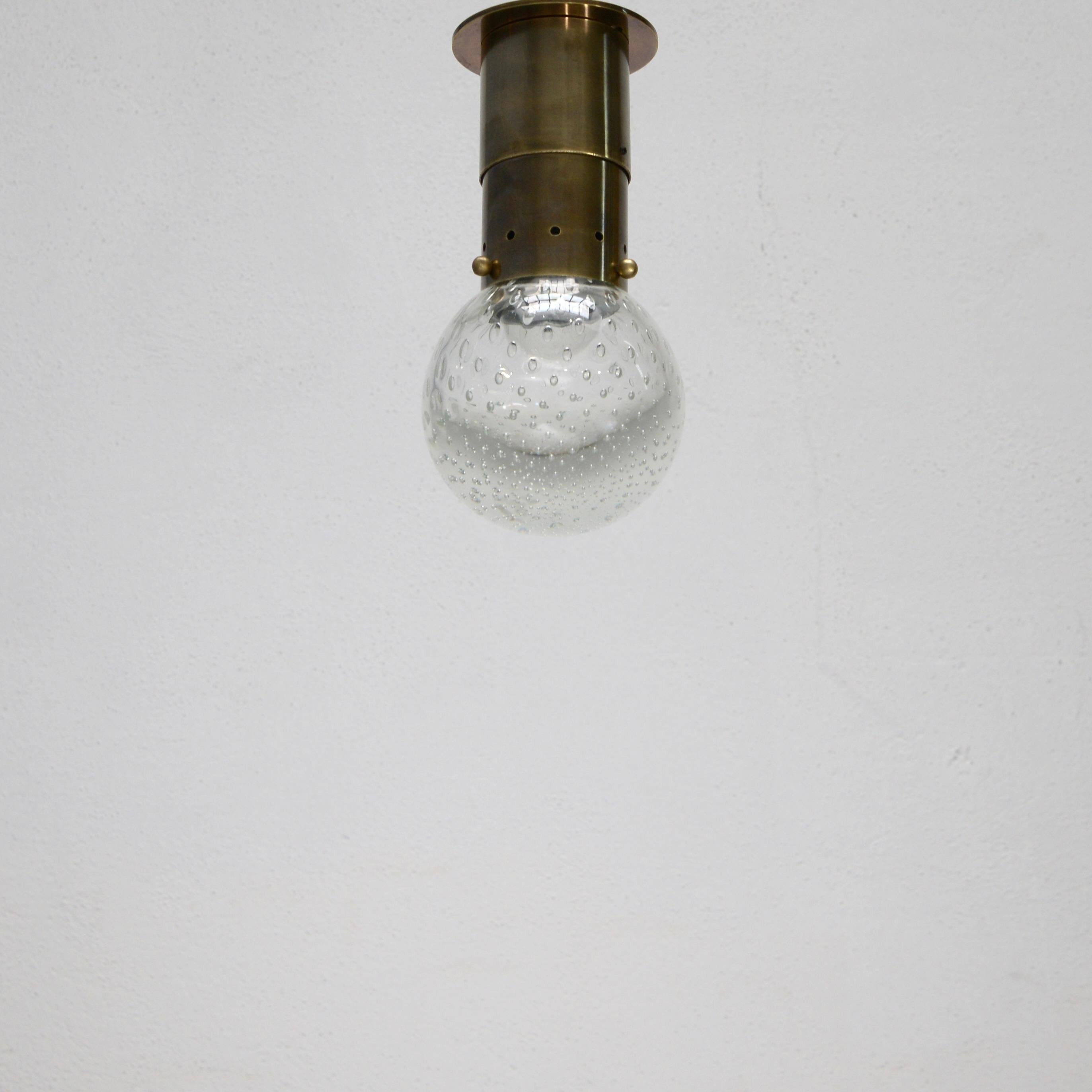 A stunning glass and brass ceiling light by Gino Sarfatti for Seguso from 1960s Italy. Patinated brass finish and blown glass, partially restored an wired with 1-E26 medium based socket for use in the US. Light bulb included with order.