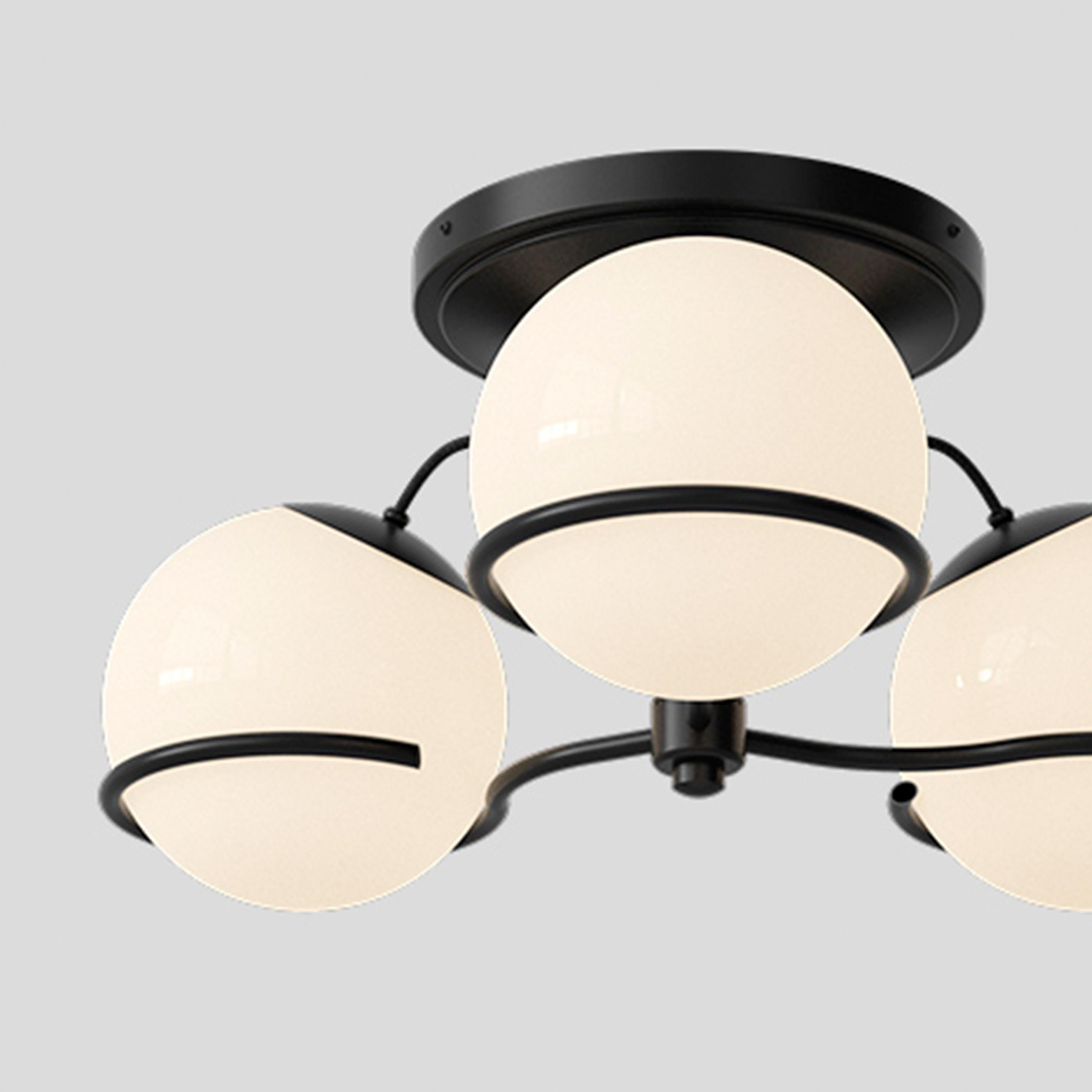 Model 2042/3
Design by Gino Sarfatti
The two blown opaline glass spheres are gently held in place by two Black, or Champagne, painted aluminum rings. Each ring has a small cut, enabling the spheres to be placed facing downward or upward and thus
