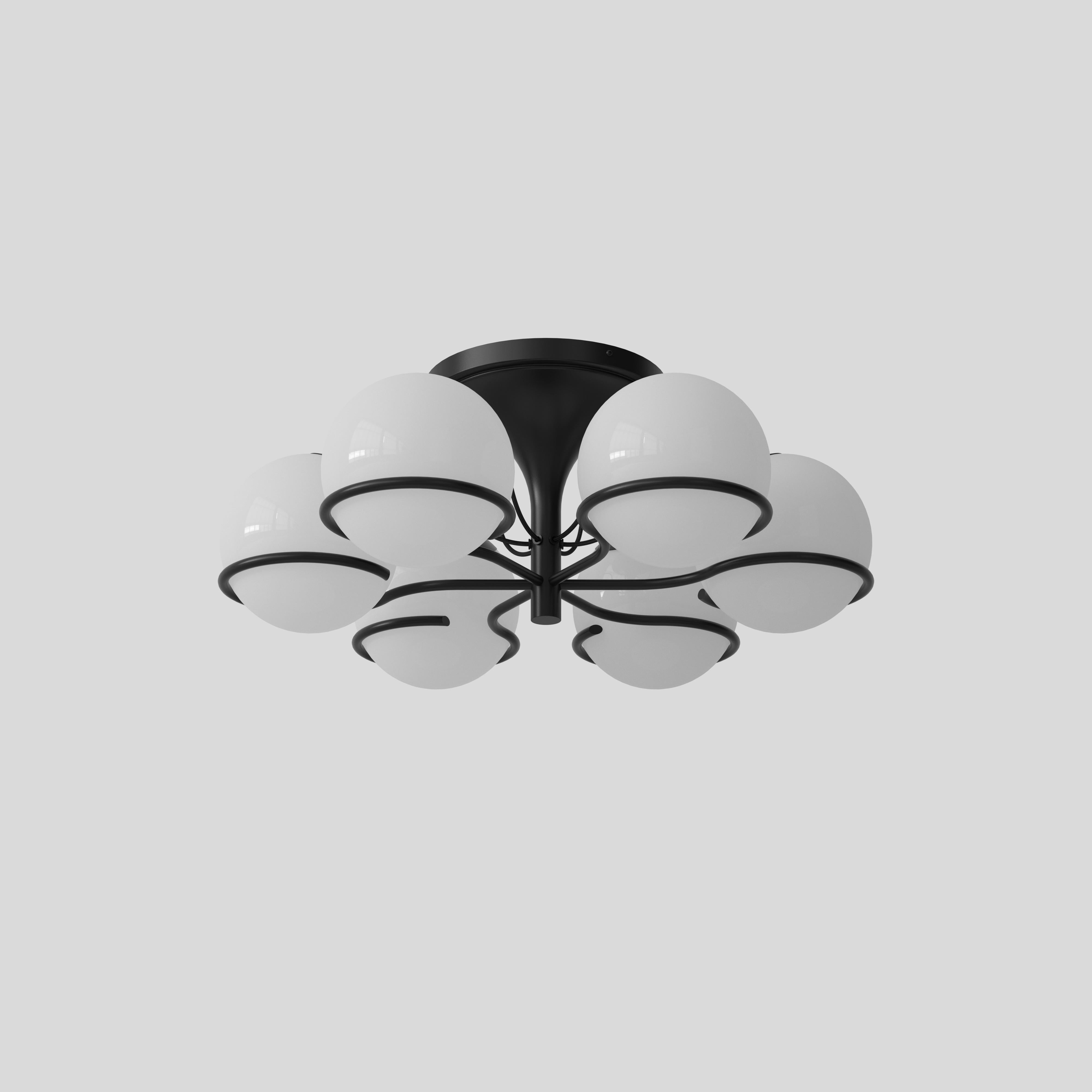 Modèle 2042/6
Design par Gino Sarfatti
Avec Le Sfere Plafone, modèle 2042/6 de 1963, une autre des belles interprétations de la sphère lumineuse par Gino Sarfatti est réintroduite. Ce plafonnier raffiné est composé de six sphères en verre opalin