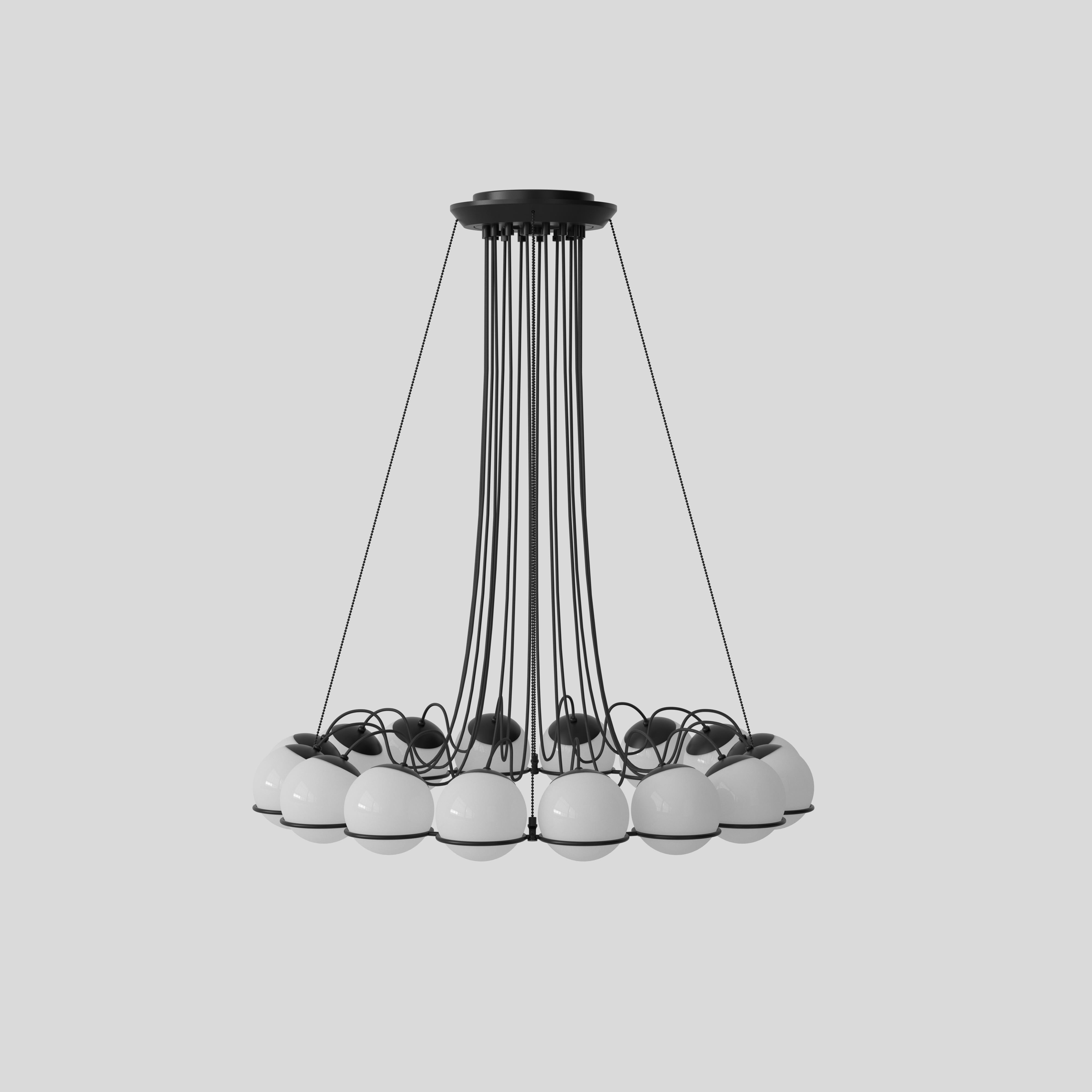 Model 2109
Design by Gino Sarfatti
The Le Sfere chandelier is composed of a circular array of blown opaline glass spheres. Each sphere is held in place by a large black or Champagne painted aluminum ring-structure. Each ring has a small cut,