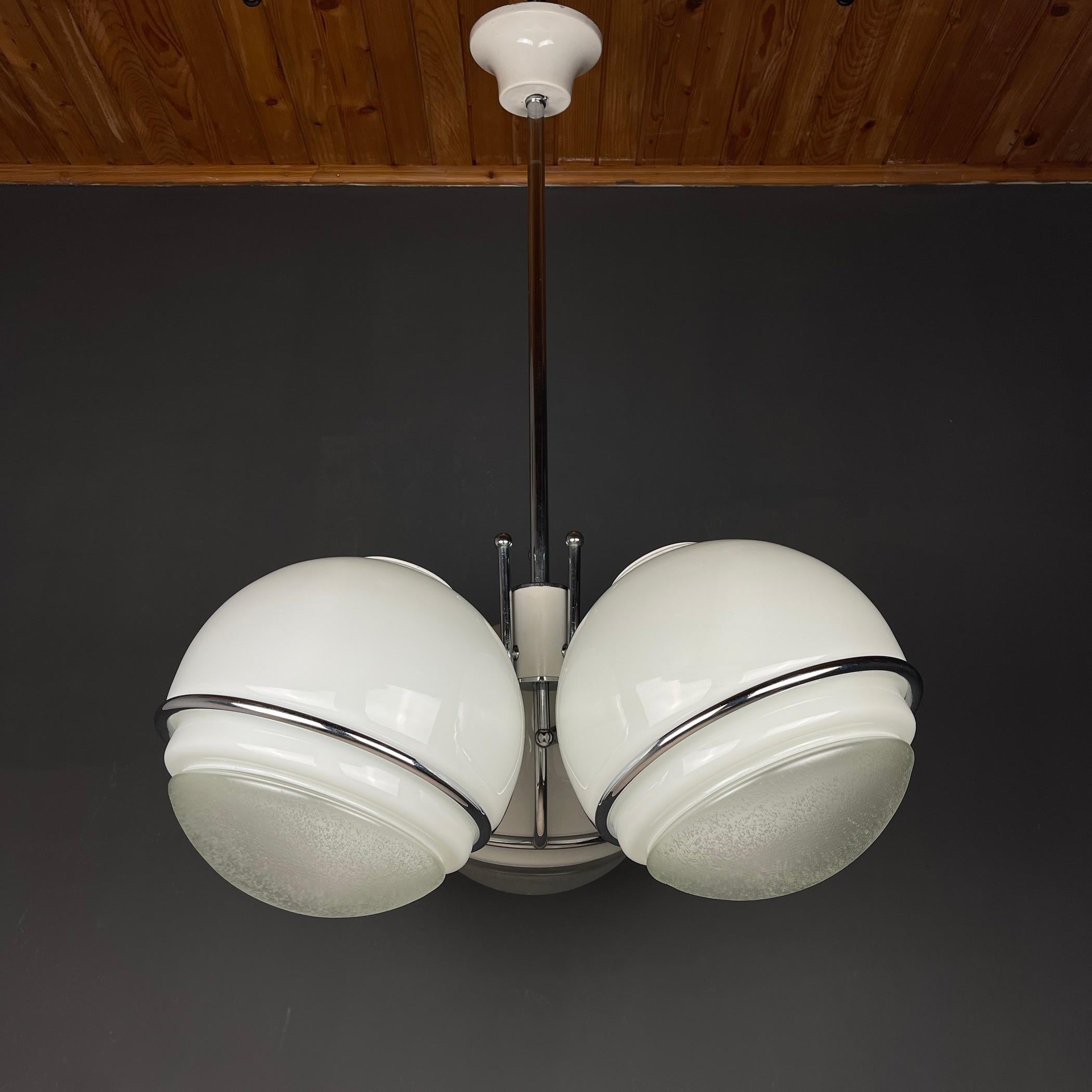 Amazing chandelier by Gino Sarfatti made in Italy in the 1960s. Made out of a metal structure holding 3 milk glass globes. Ball diameter 30 cm. Each ball consists of two parts - transparent and milky white. Gives a beautiful diffuse light emission.