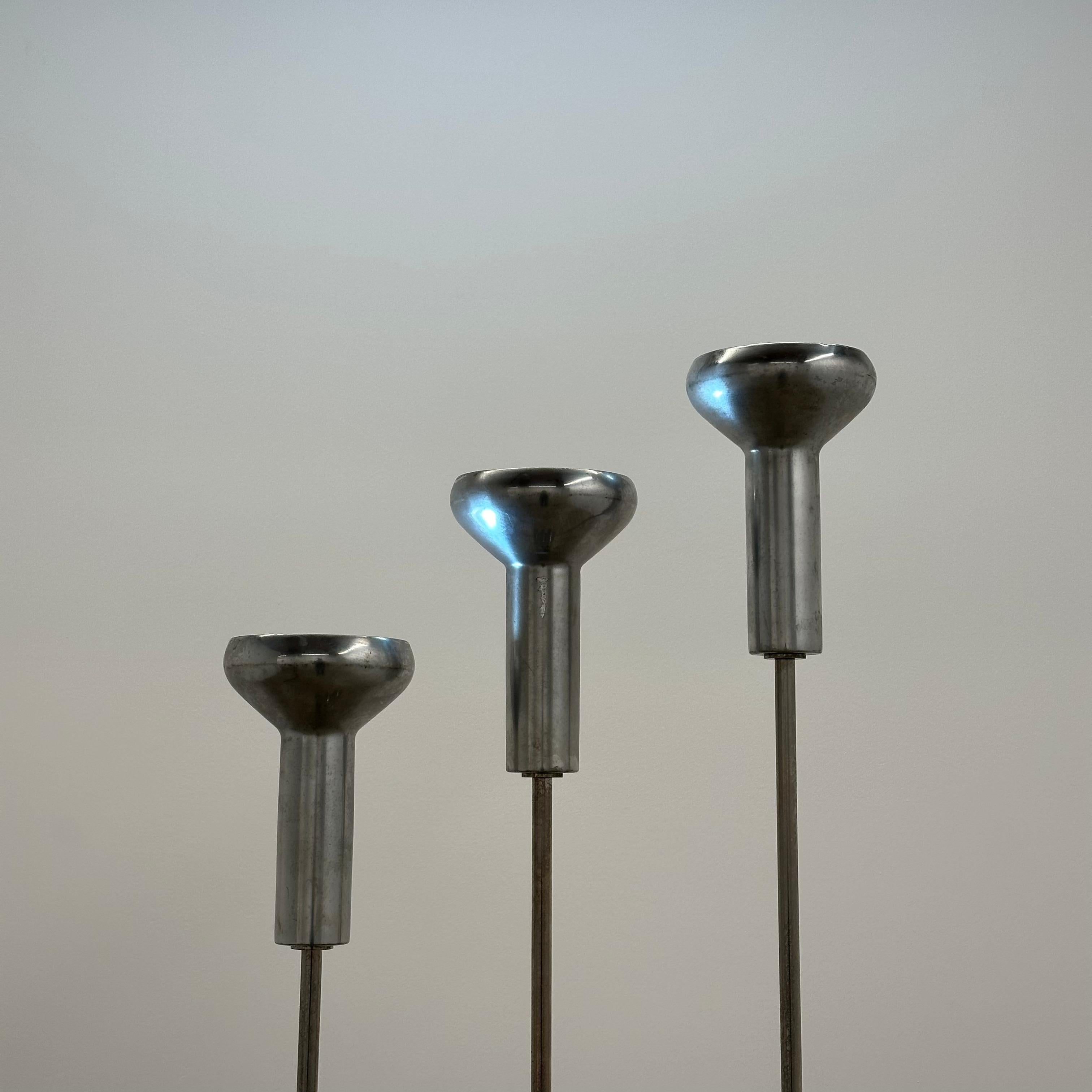 Gino Sarfatti model 1073 floor lamps for Arteluce, Italy, 1960s.

Dimensions: 81.5” H x 9.45” W x 9.45” D (Large), 77.95” H x 9.45” W x 9.45” D (Medium), 72.05” H x 9.45” W x 9.45” D (Small)