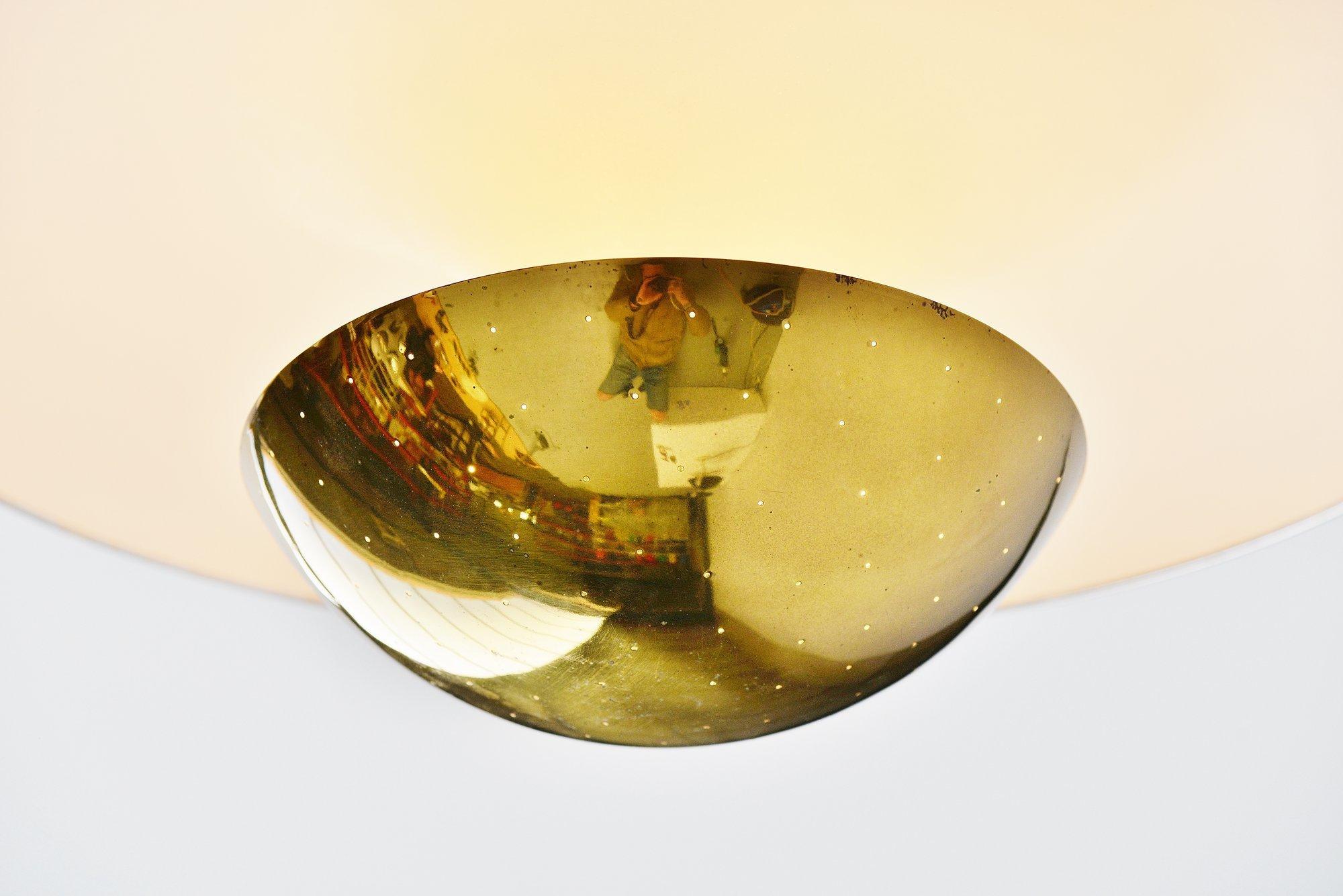 Rare large ceiling lamp designed by Gino Sarfatti for Arteluce, Milano, 1950. This very nice dish shaped ceiling lamp is Mod. No. 155 and was made of white lacquered aluminum and brass edge and diffuser shade. This lamp gives fantastic light when