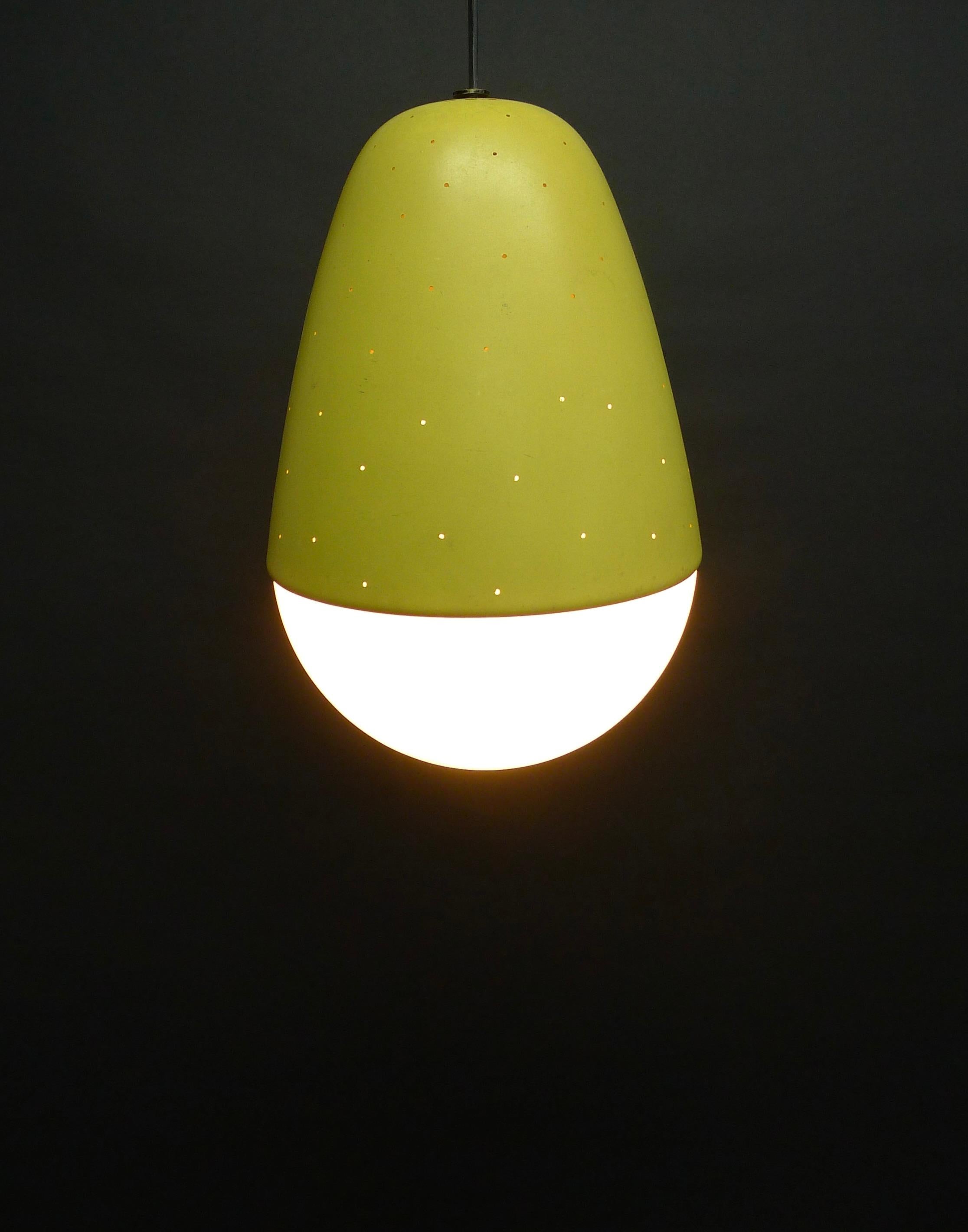 Pendant light, model no. 2079, by Gino Sarfatti, design 1955, manufactured by Arteluce, Italy. 

Micro perforated lacquered aluminium shade over an opaline glass diffuser. Completely original and in good condition for age and use.

33cm high, 20cm