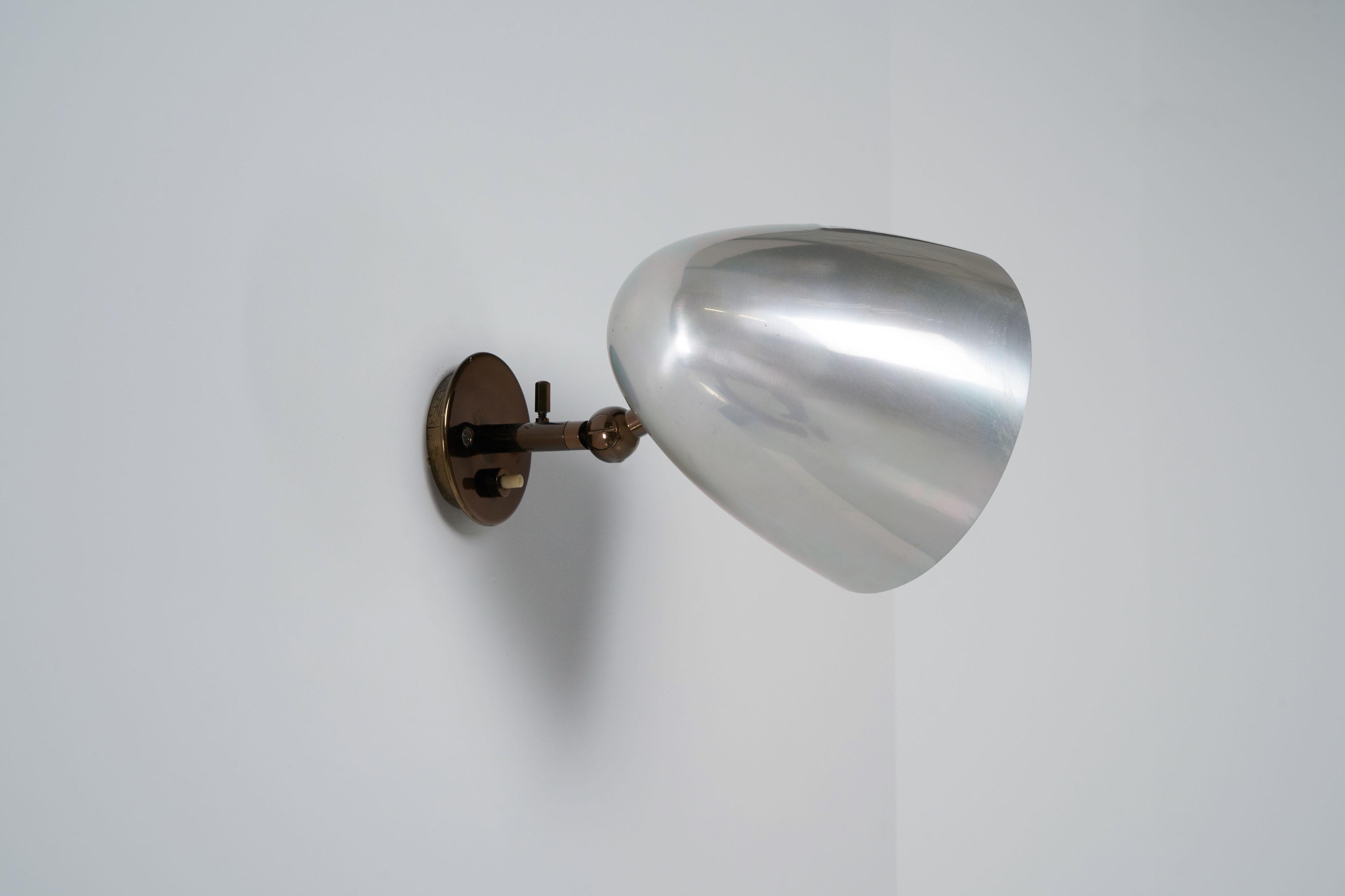 Minimalistic model 27 sconce designed by Gino Sarfatti and manufactured by Arteluce, Italy 1956. This minimalistic sconce was designed by one of the greatest light designers from the mid-20th century. This sconce has a very nice elliptical shaped