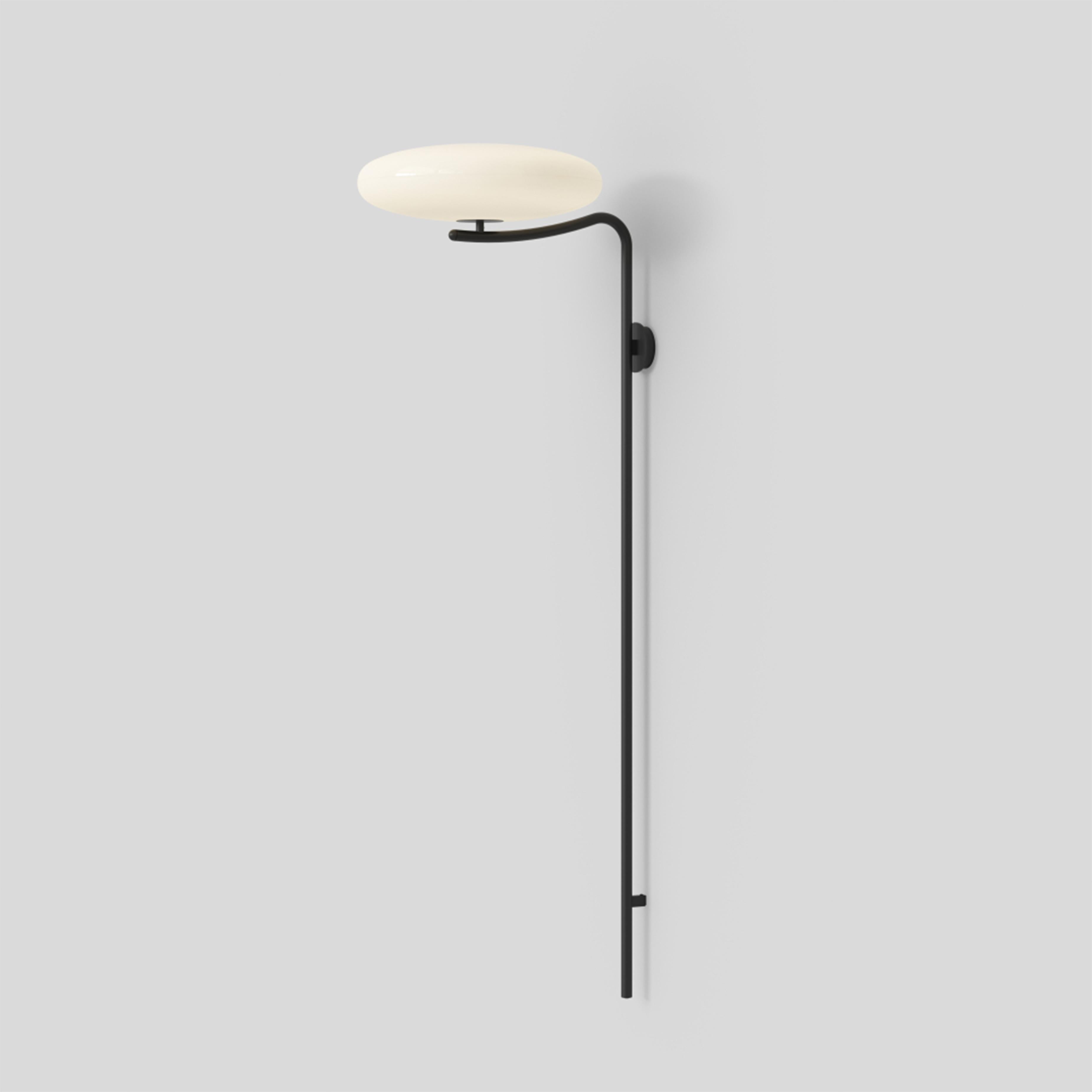 Gino Sarfatti wall lamp Model 2065 wall.
White diffuser, black structure.
Manufactured by Astep

Model 2065
Design by Gino Sarfatti
The 2065 is made of two joined opaline methacrylate saucer-shaped diffusers suspended from the ceiling with a