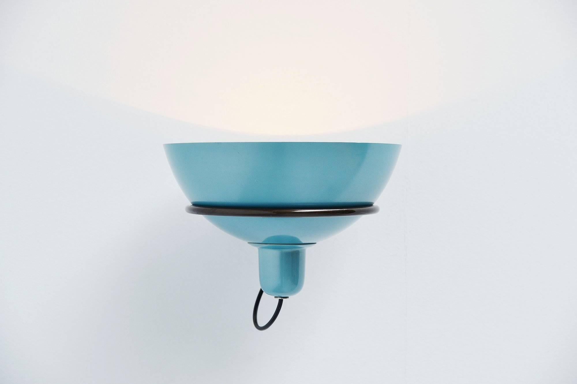 Single wall lamp model 2/1 designed by Gino Sarfatti, manufactured by Arteluce, Italy, 1960. This nice wall light has an adjustable reflector lacquered in blue on the outside, bar ring and wall flange in patinated aluminum. The lamp is unmarked but