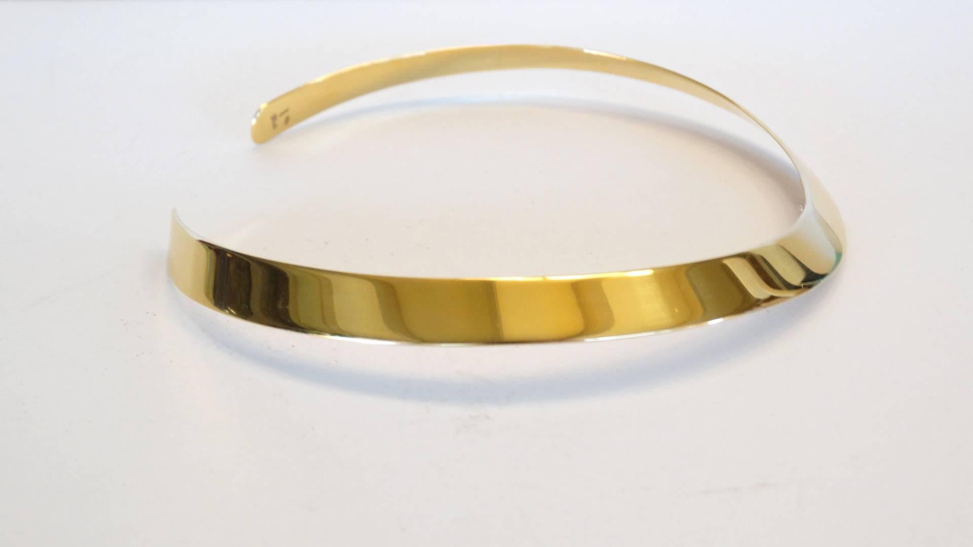 This is a beautiful necklace from the italian designer Gio Carlos, this collar is solid 18 karat yellow gold it is 11mm wide. Hallmarked and signed and is also signed 750. This piece measures 14 inches without the opening. A wonderful statement