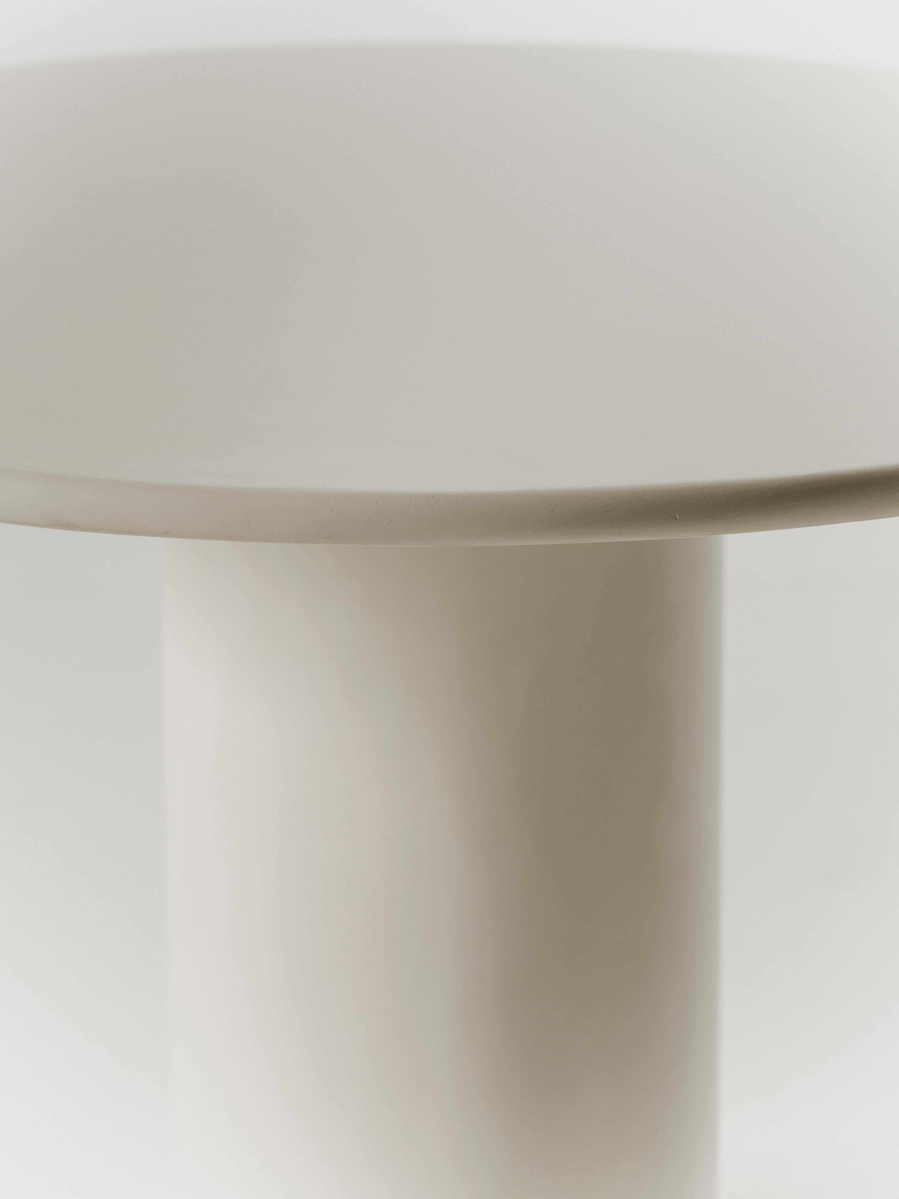Handcrafted in Spain by expert artisans, this oval-shaped dining table from Marlot Baus combines timeless design with modern craftsmanship. Each piece is carefully made using our signature microcement technique, layered by hand to achieve a smooth,