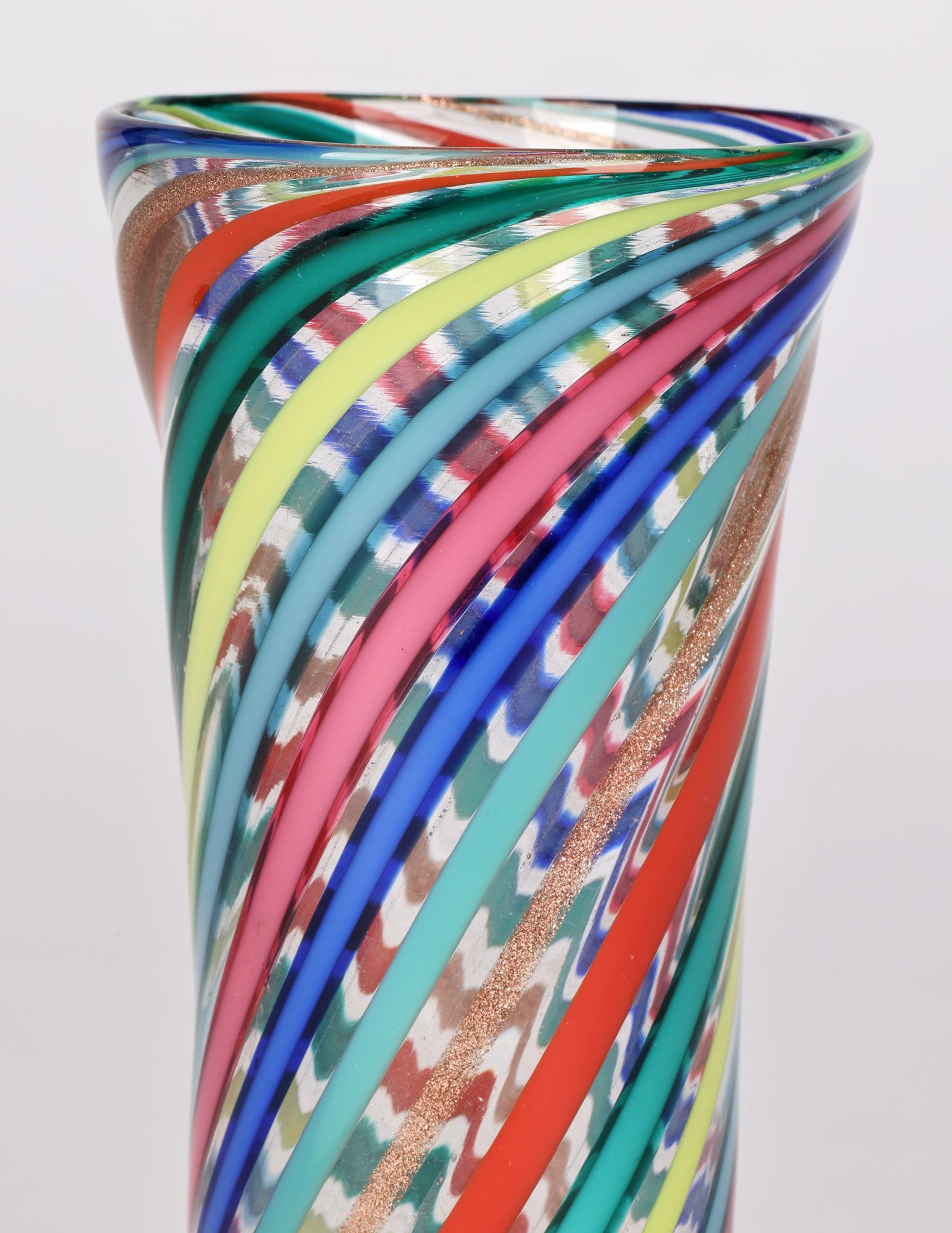 A very fine Murano, possibly Venini, A Canne tall slender glass vase with trailing colored ribbons attributed to Gio Ponti (Italian, 1891-1979) dating from around 1955. This stylish vase stands on a narrow rounded foot with gold aventurine