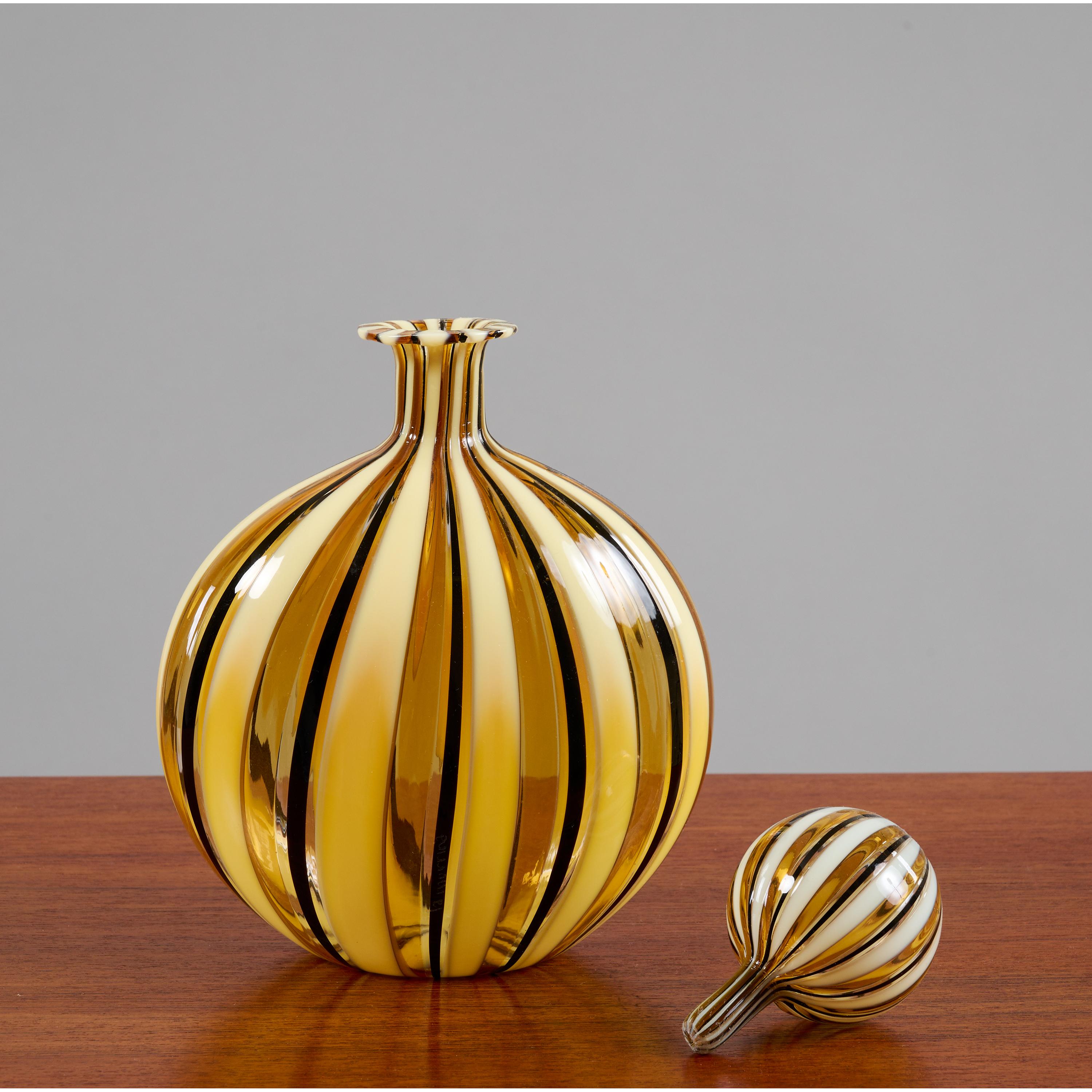 Gio Ponti (1891 - 1979), attributed to 

A graceful hand-blown Murano glass bottle attributed to Gio Ponti, with lively filigrana in alternating clear and opaque stripes of yellow, black, and white. The vase's frontally rounded shape tapers on the