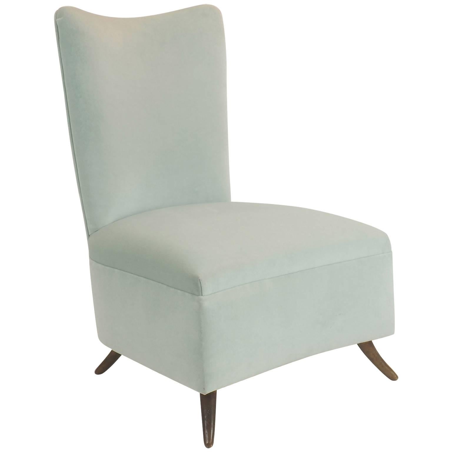 Charming and elegant rare armchair/ slipping chair manufactured by ISA and attributed to Gio Ponti design.
Velvet upholstery in elegant light Verde Acqua color, with rounded brass feet.
Reupholstered with Italian pure cotton velvet, soft and