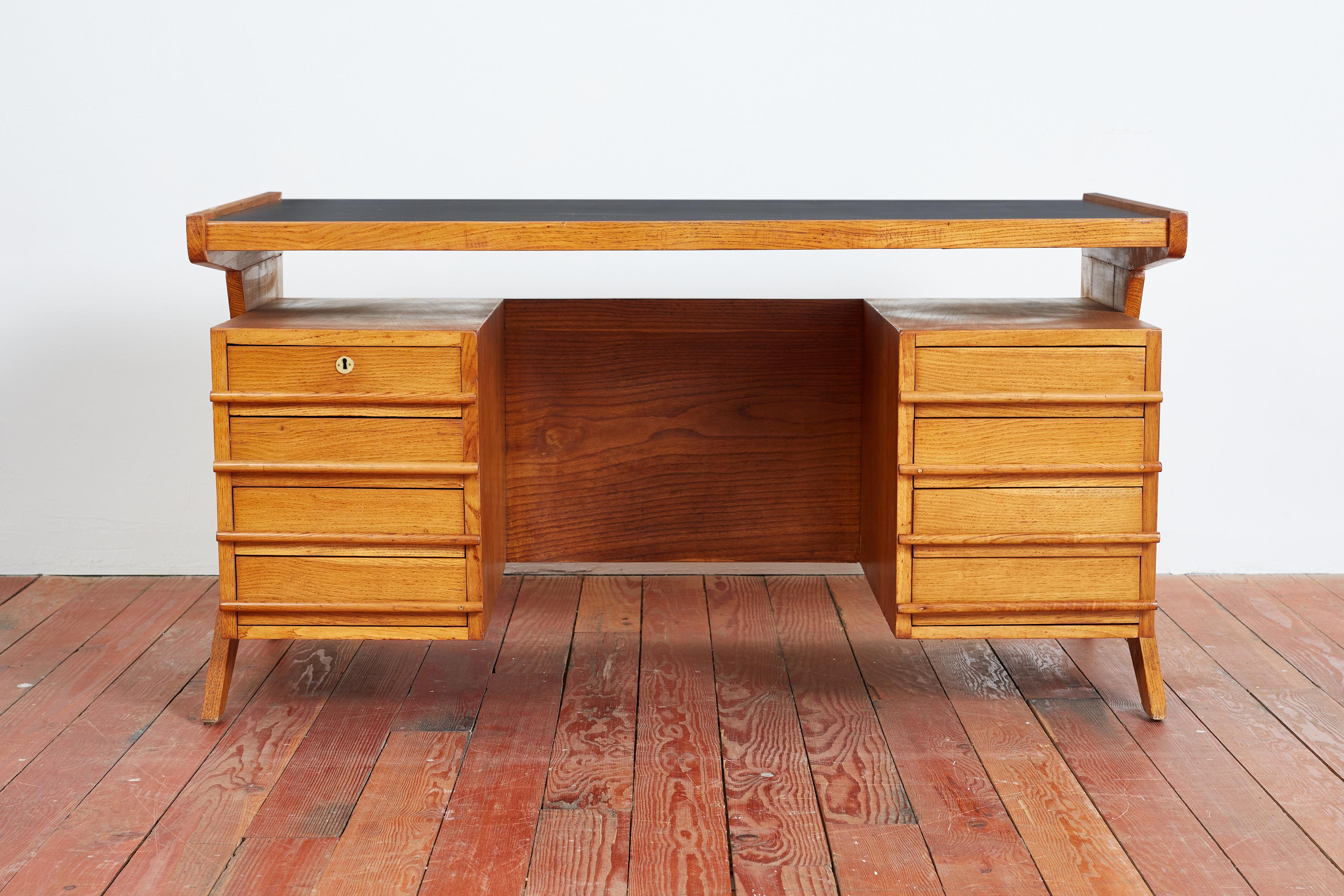 Rare Gio Ponti attributed desk - Italy, 1950s 

Gorgeous from every angle with floating top and drawers and angular scissor legs 

Constructed of oak wood and original black top 

Incredible piece. 