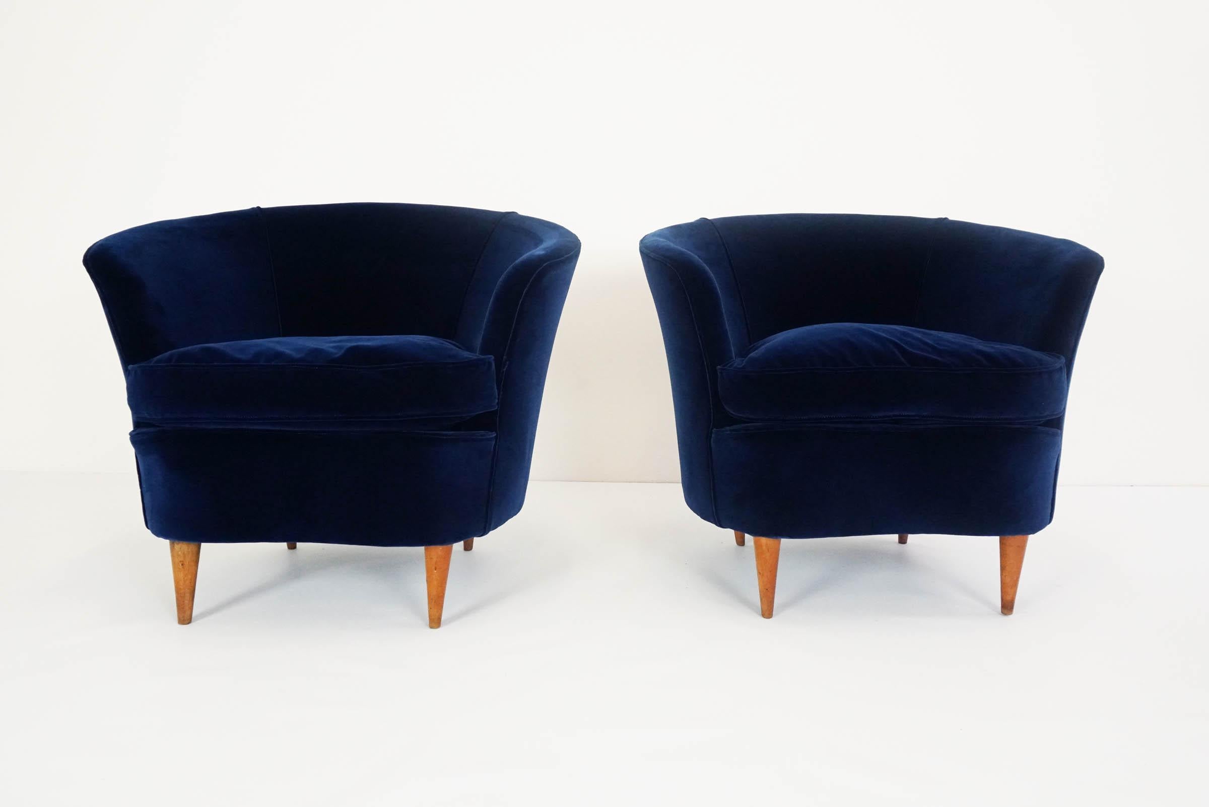 Totally reupholstered in 1st class deep blue velvet
Also available a two-seat sofa

An archived photograph of the present model armchairs and sofa is held in the 