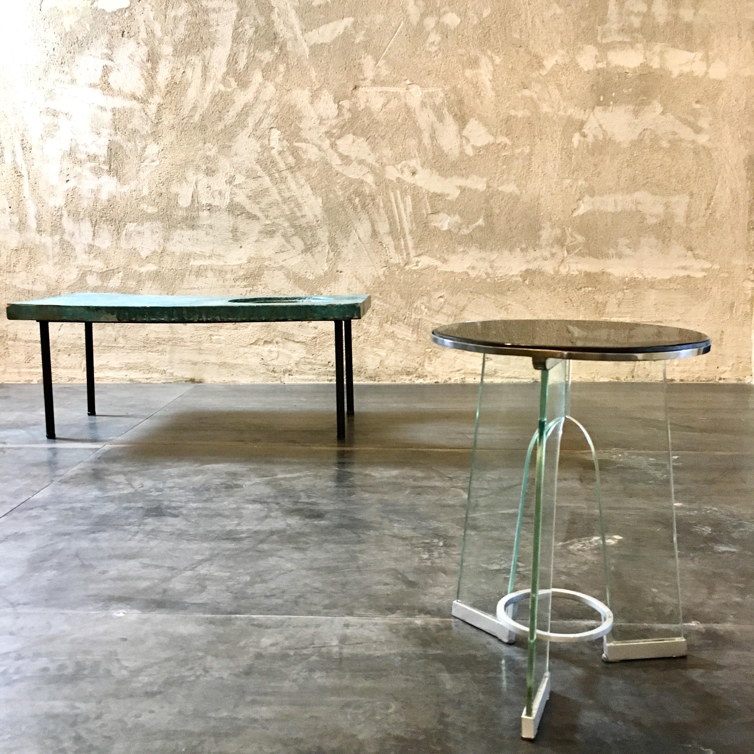 Iconic and rare occasional table designed by Gio Ponti in 1932 ca and produced by Luigi Fontana.
The top is in black vitrolite and is mounted on a chrome-plated brass structure. Each tempered glass element is acid-etched with 