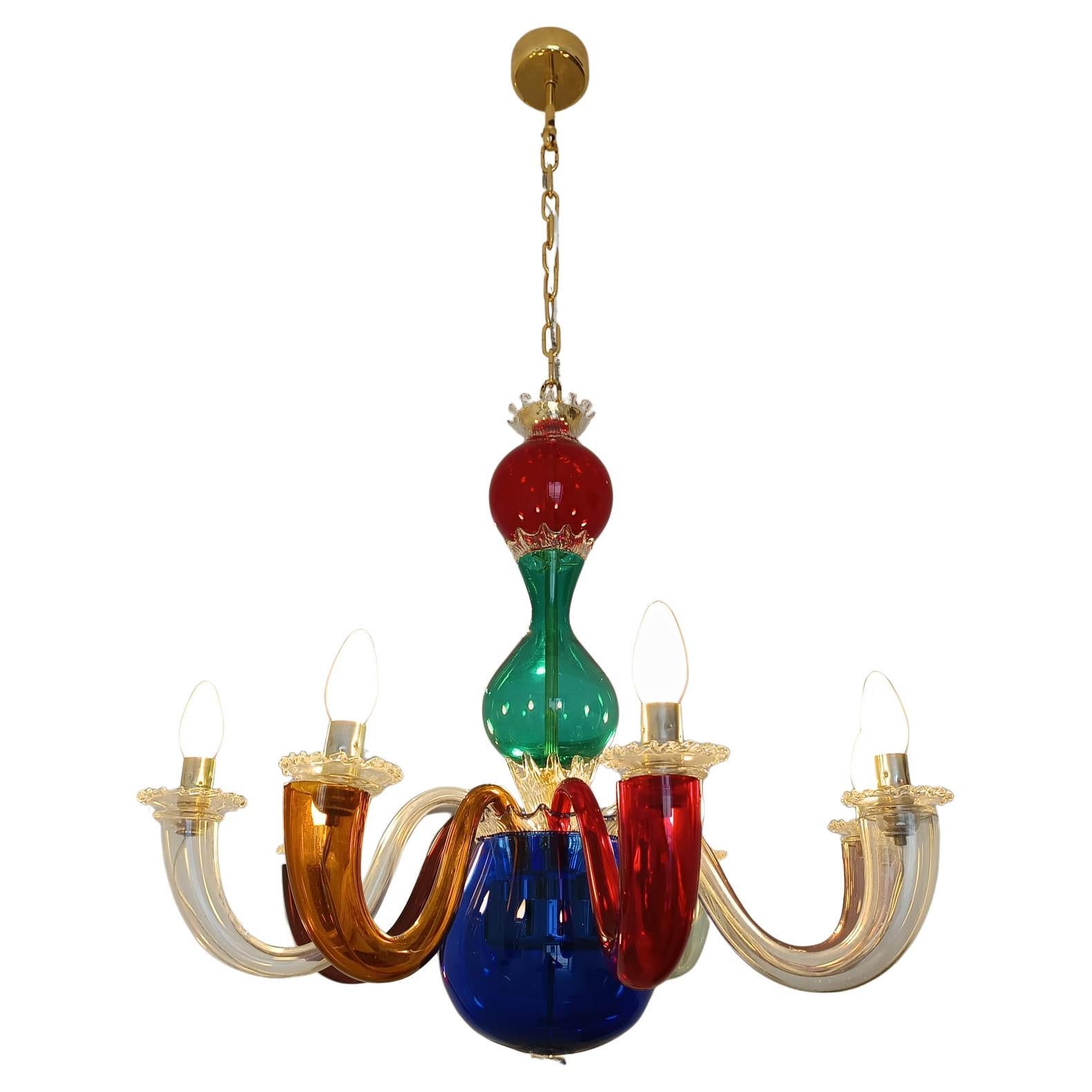 Eight-light chandelier made by Venini, the historic Murano glass company, in collaboration with Gio Ponti. The glass is hand-blown and handcrafted, using typical Venetian color techniques, mixing transparent, opaline, and colored glass.
The metal