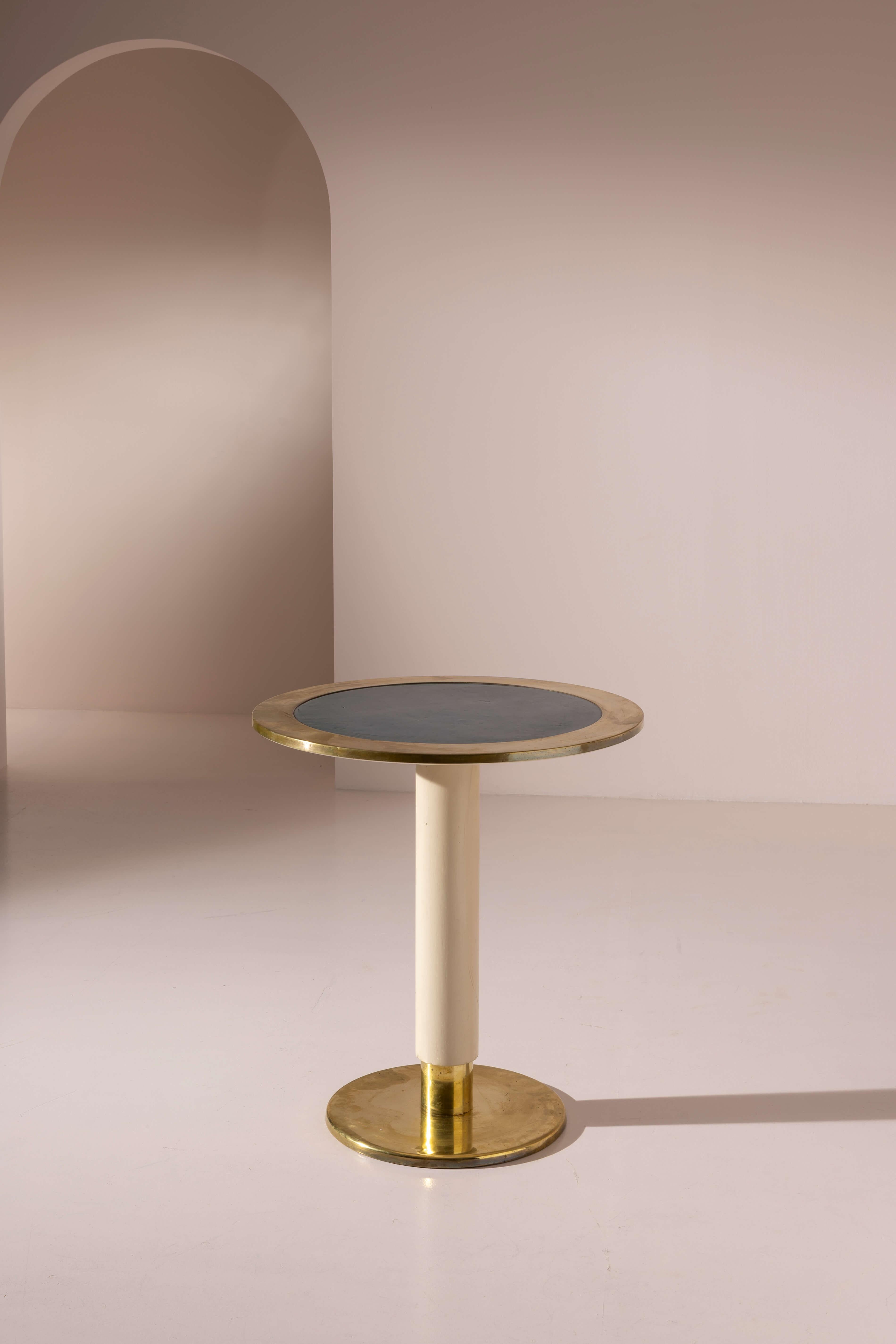 A rare and highly collectible occasional table in brass, wood, and linoleum from the furnishings of the motor ship Oceania – design by Gio Ponti, Italy, 1952

Evocative images remain of the great ocean liners that once connected Europe to the